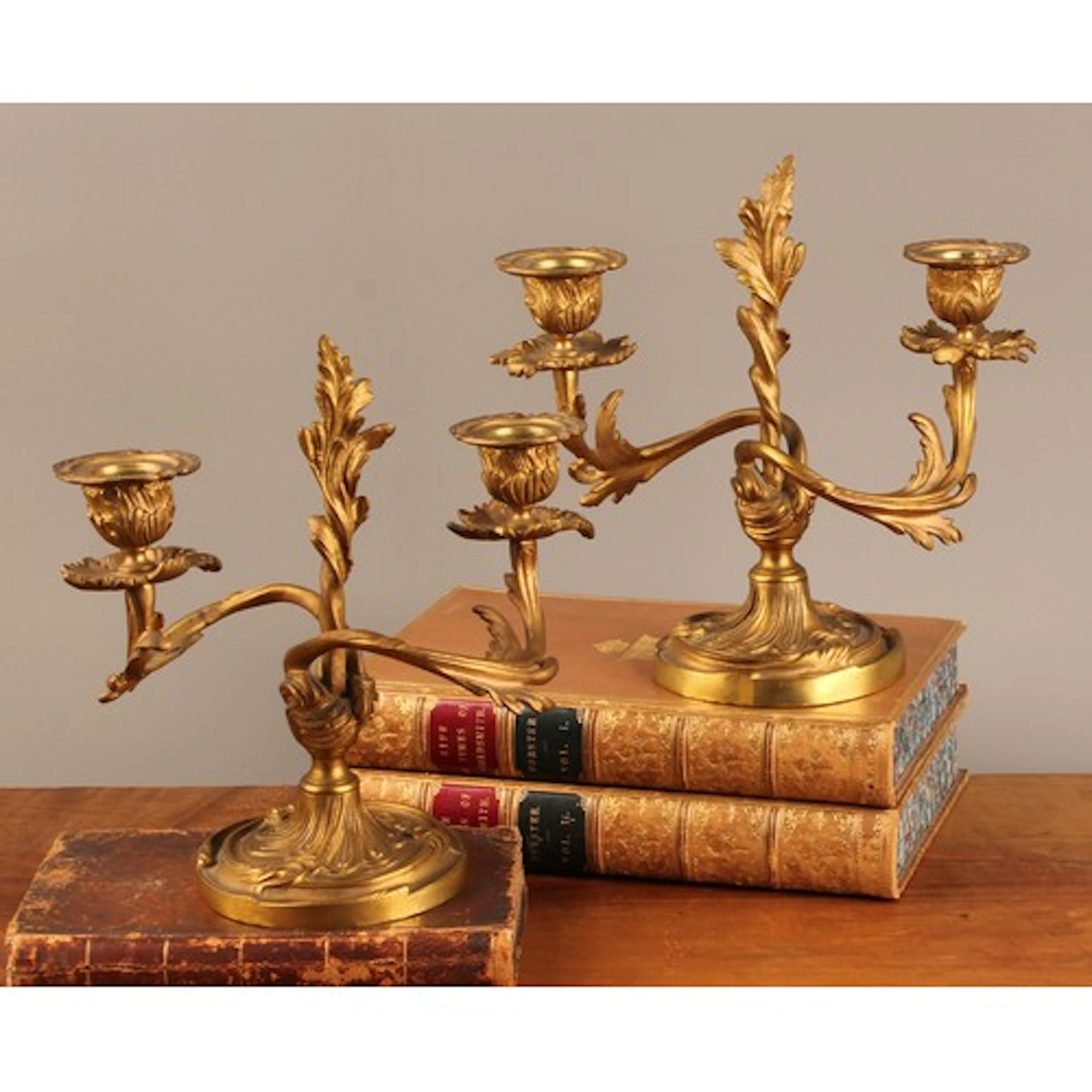 A pair of 19th century Rococo Revival ormolu two-light mante...