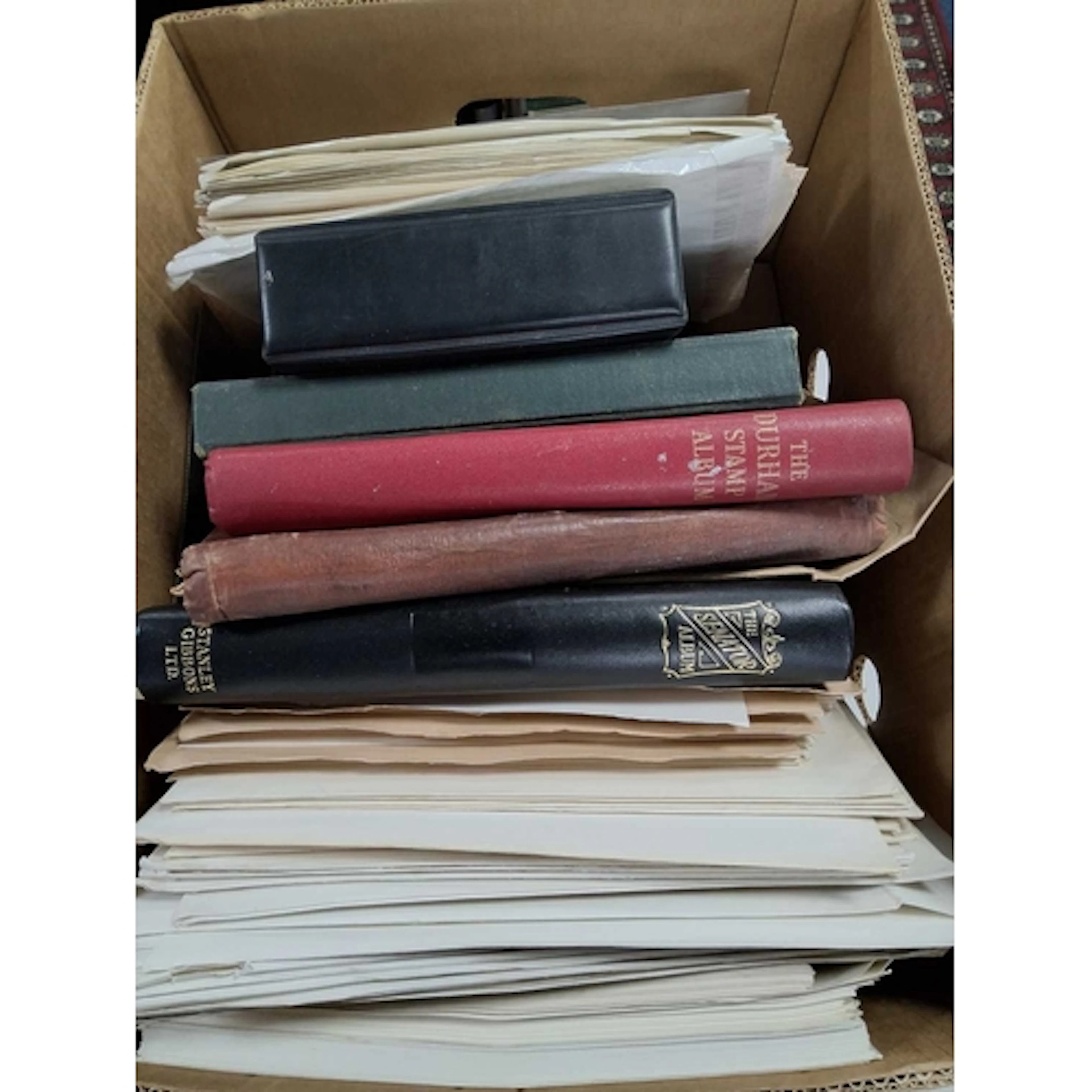 COLLECTION OF STAMPS IN A LARGE BOX WITH WORLDWIDE COLLECTIO...