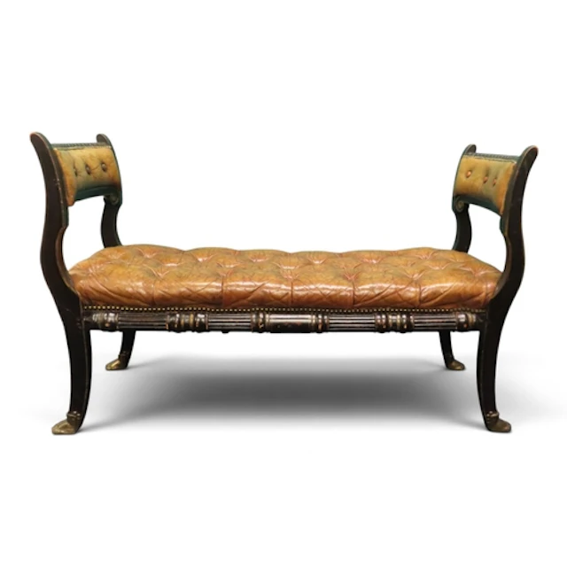 A 20th century Regency style brown leather button upholstere...