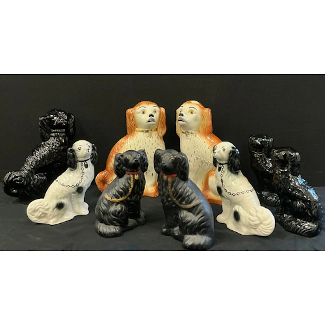 A pair of large Staffordshire dogs in orange and white, gilt...