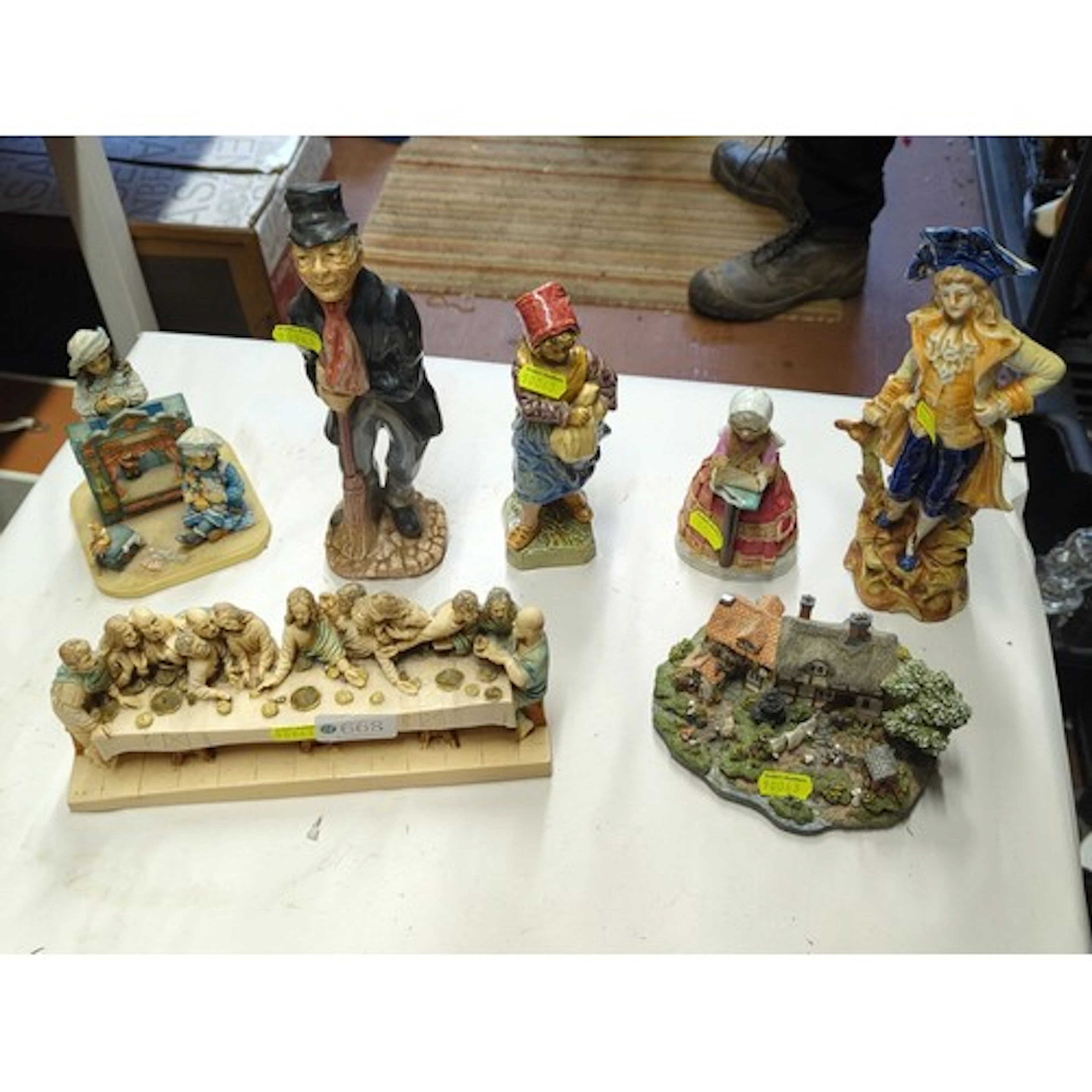 A group of polychrome ceramic and resin figural ornaments, i...