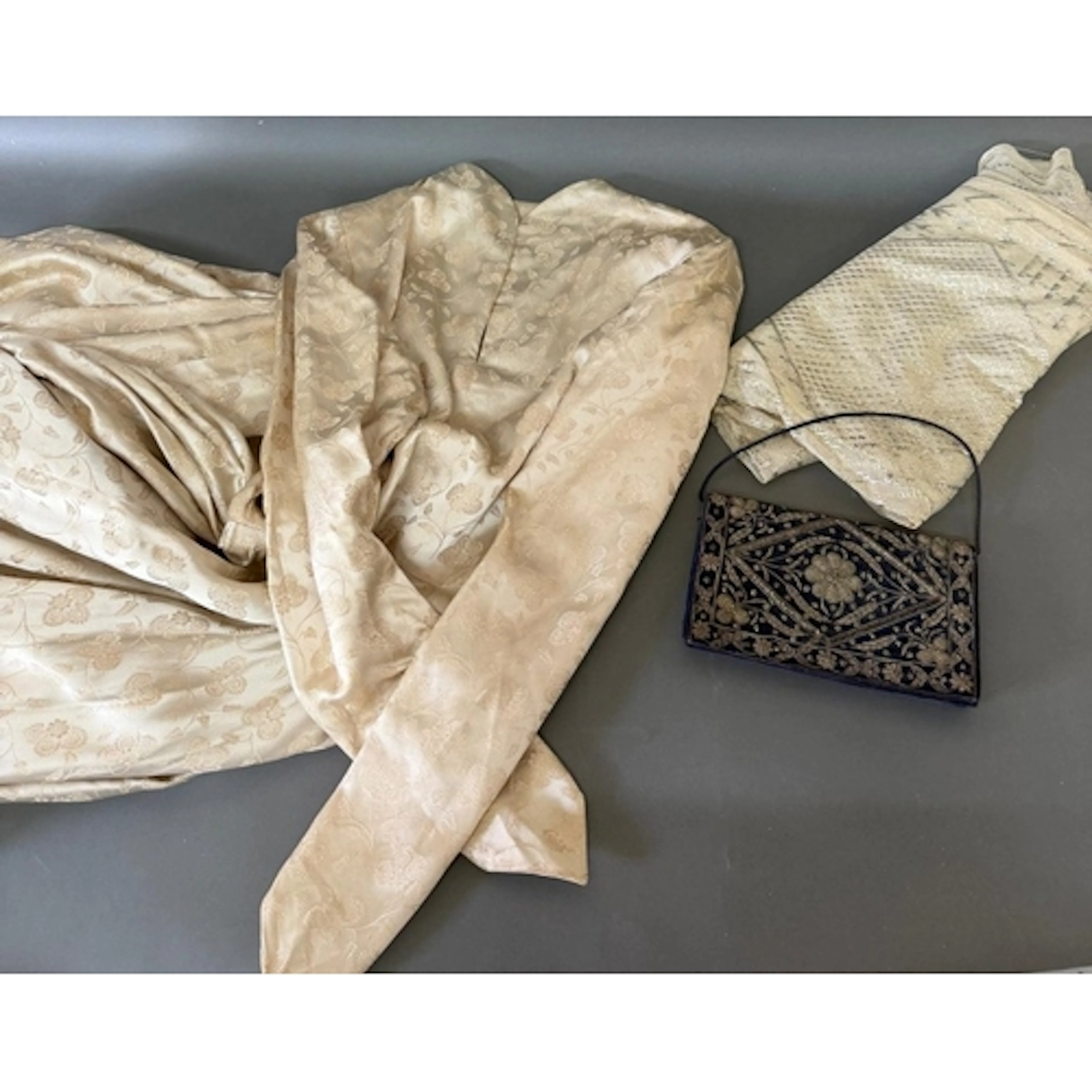 A vintage silk wedding dress along with a clutch bag, size 1...