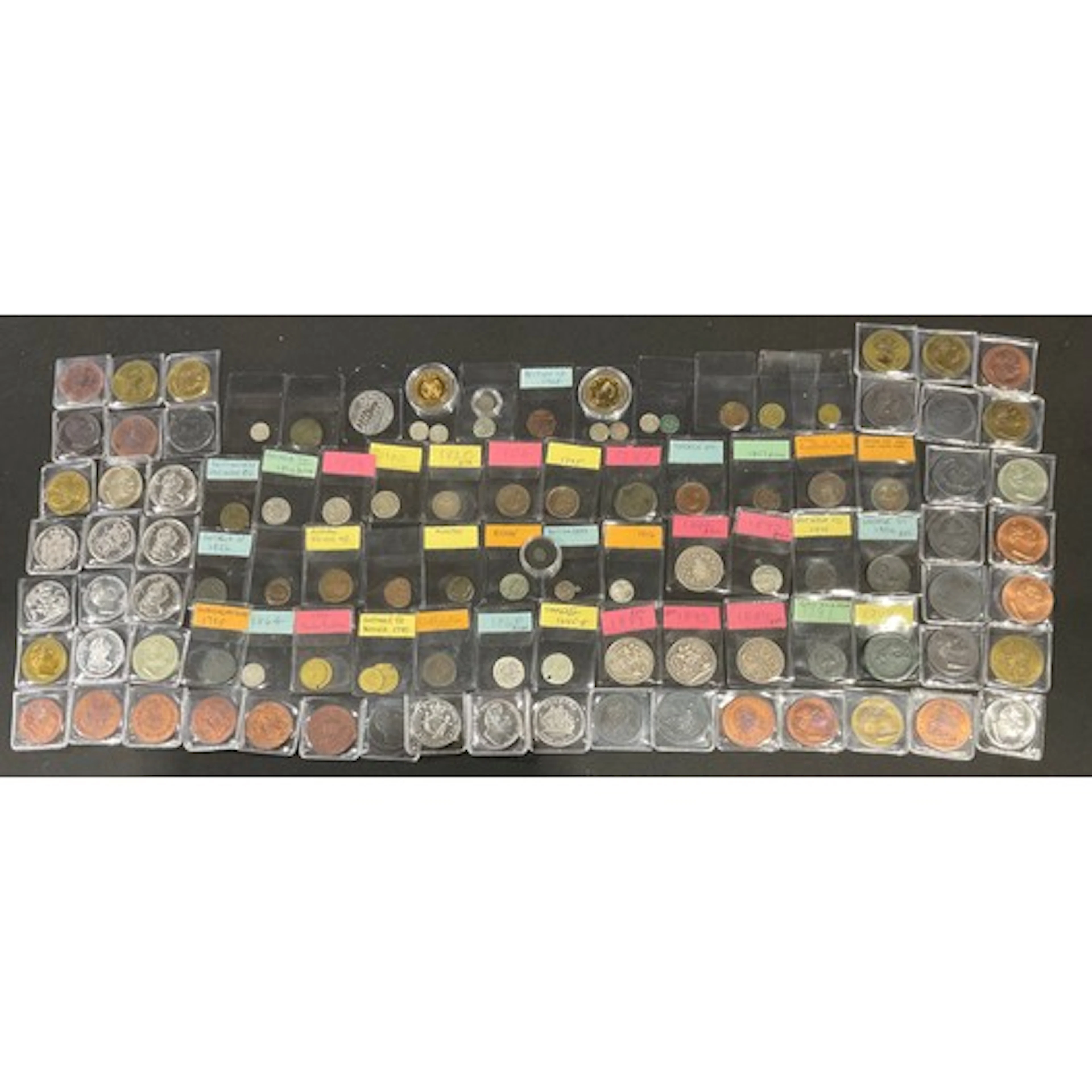 Numismatics – A collection of coins in two collector’s boxes...