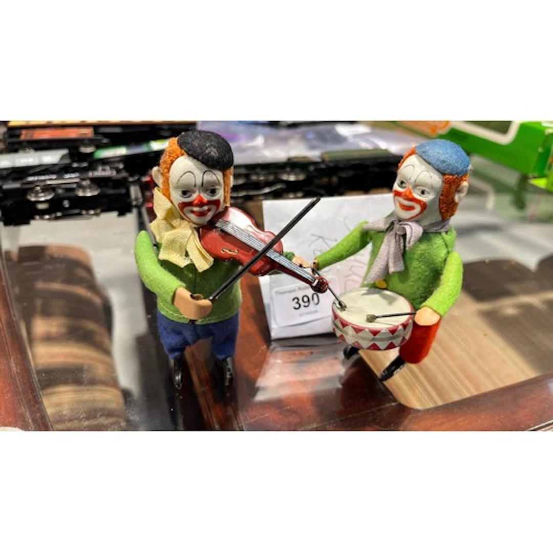 Two Schuco clockwork clown musicians, one with drum the othe...