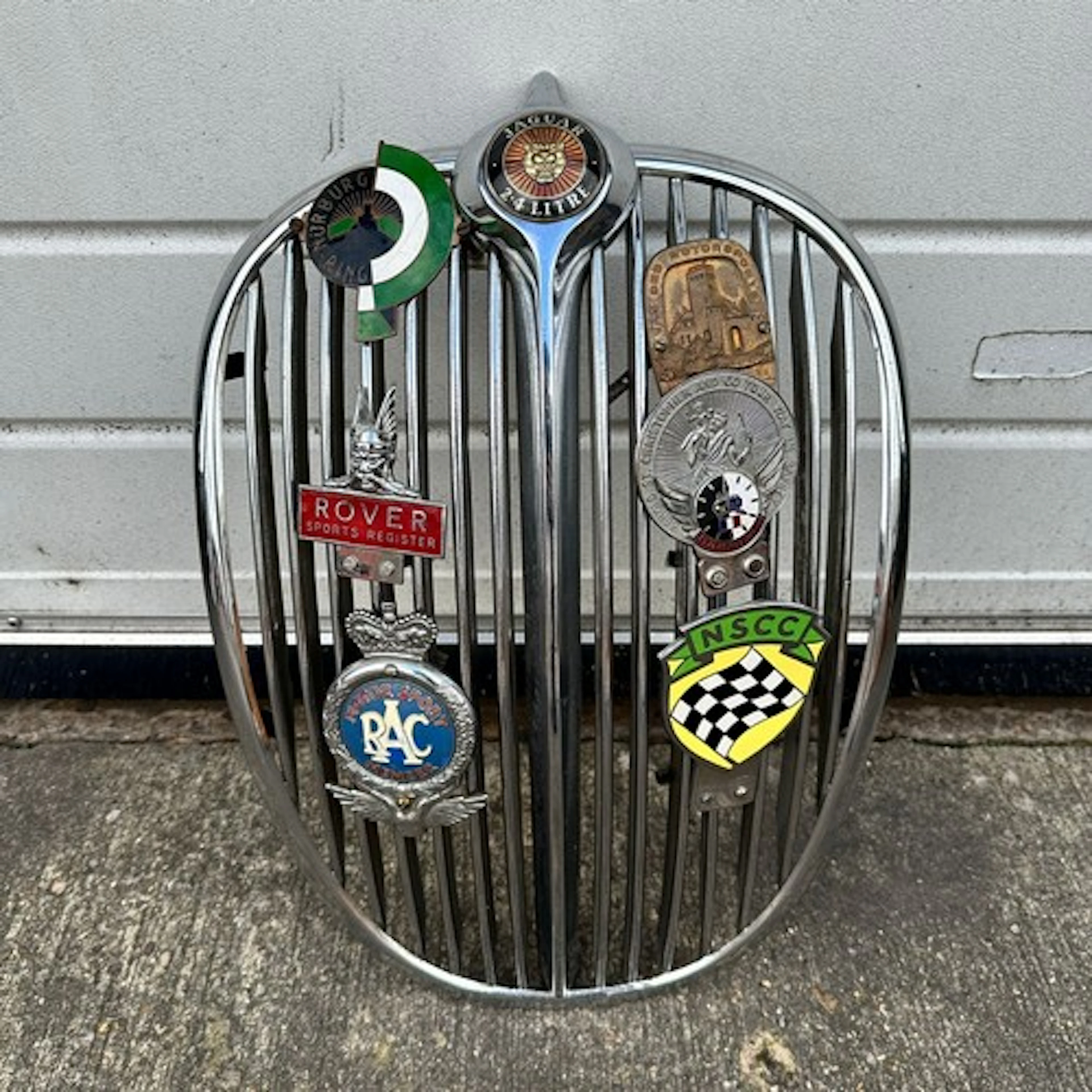 A Jaguar 2.4 litre chrome front radiator grille, with circul...
