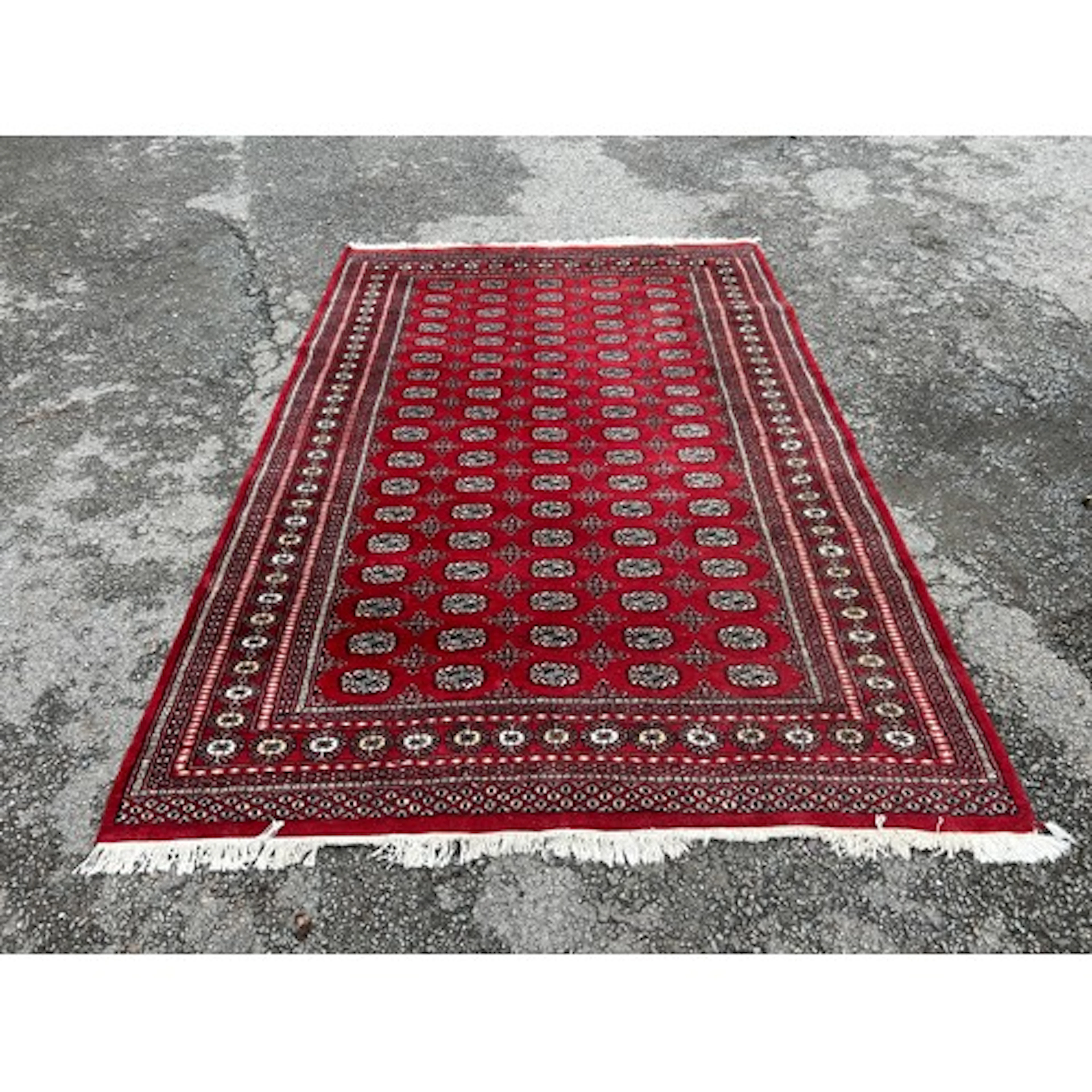 Hand-knotted Pakistan Bokhara style rug in creams & reds...