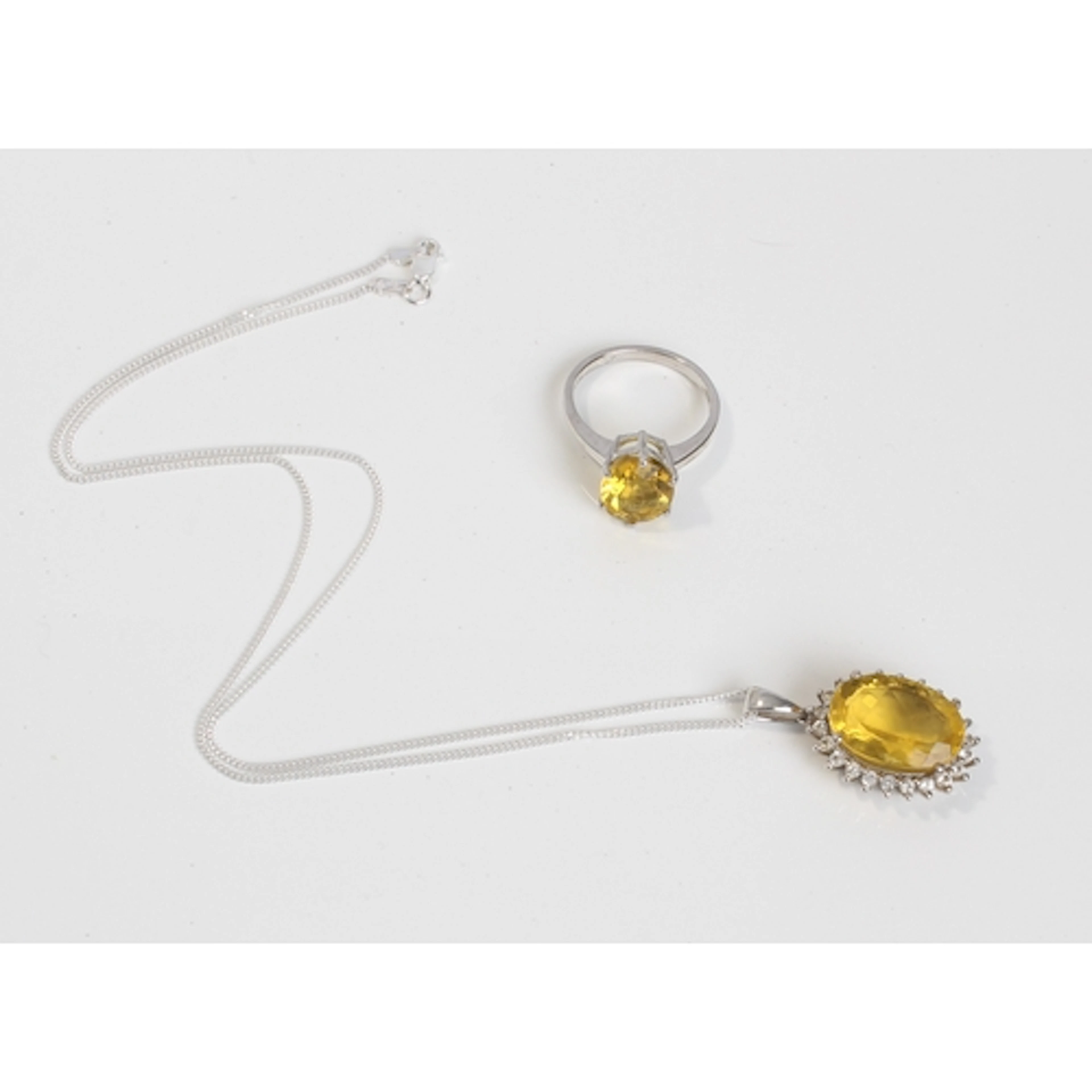 A sterling silver and Golden Fluorite ring and matching pend...