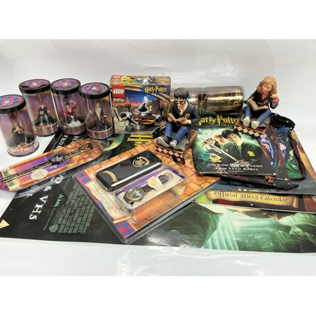 A collection of Harry Potter related items comprising booken...