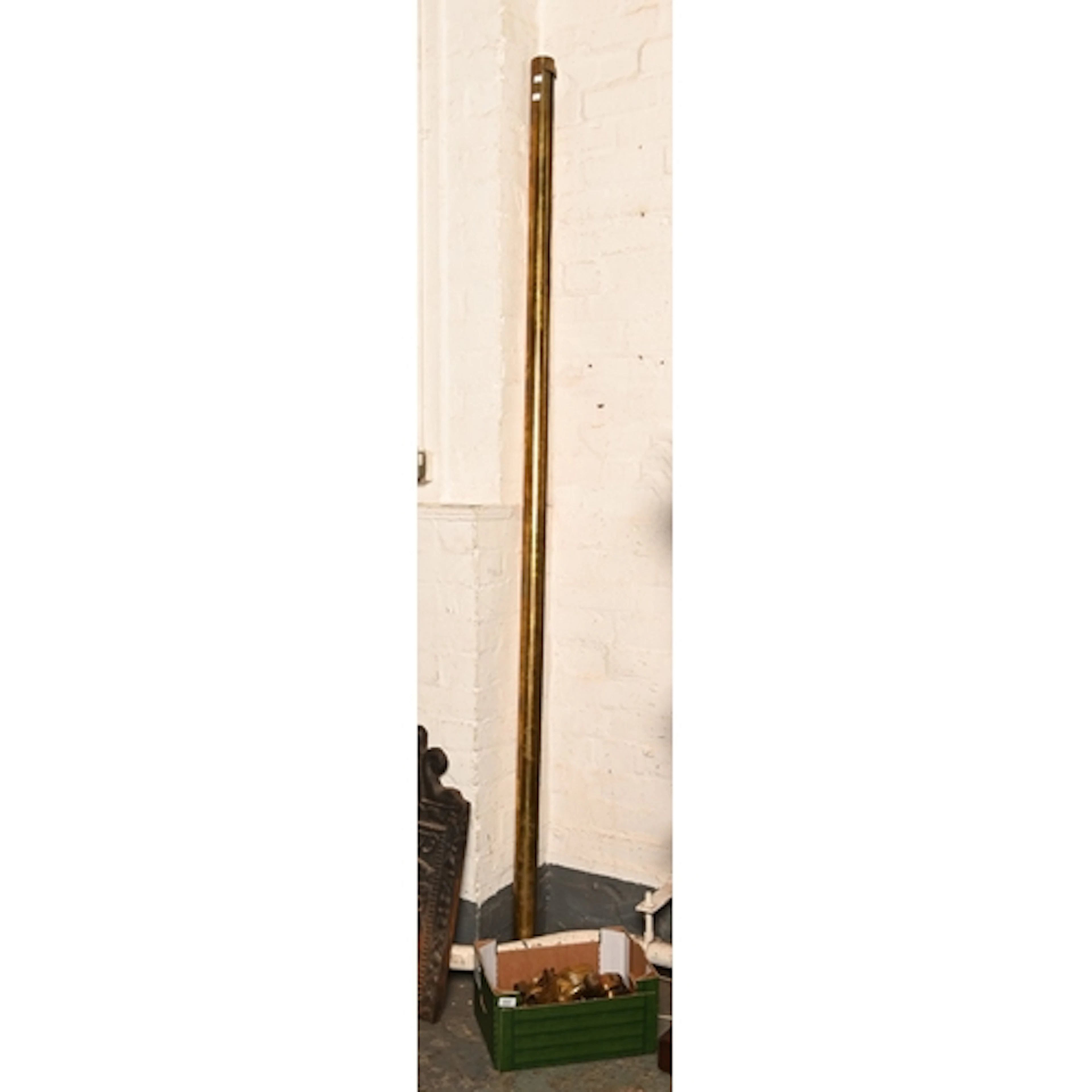 A brass Country House curtain pole, early 20th c, with rings...