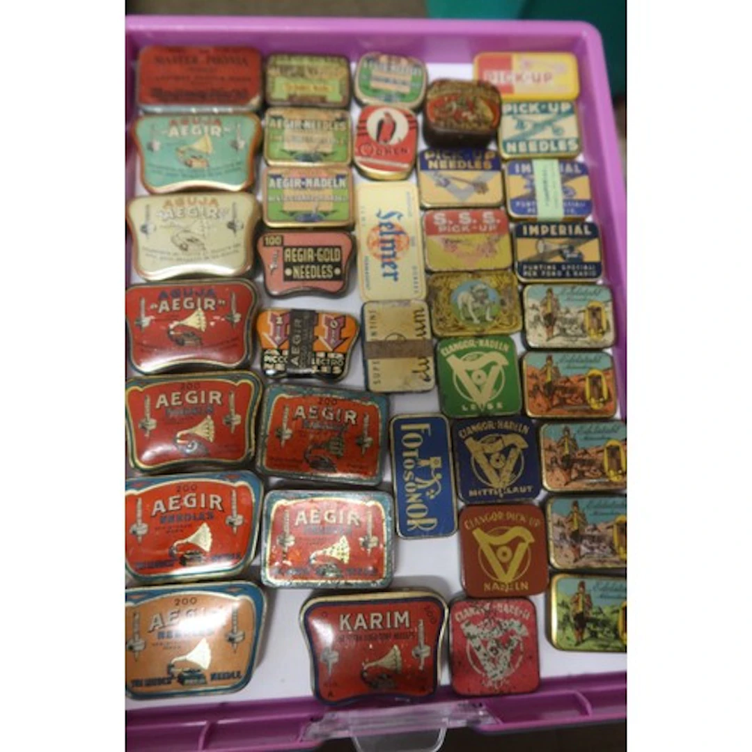 A tray of vintage gramophone needle tins