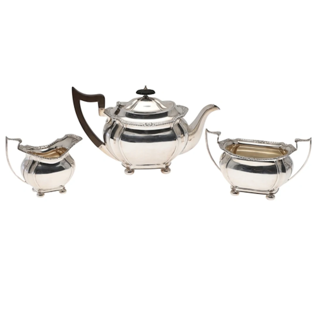 AN EARLY 20TH CENTURY SILVER THREE PIECE TEASET. To include ...