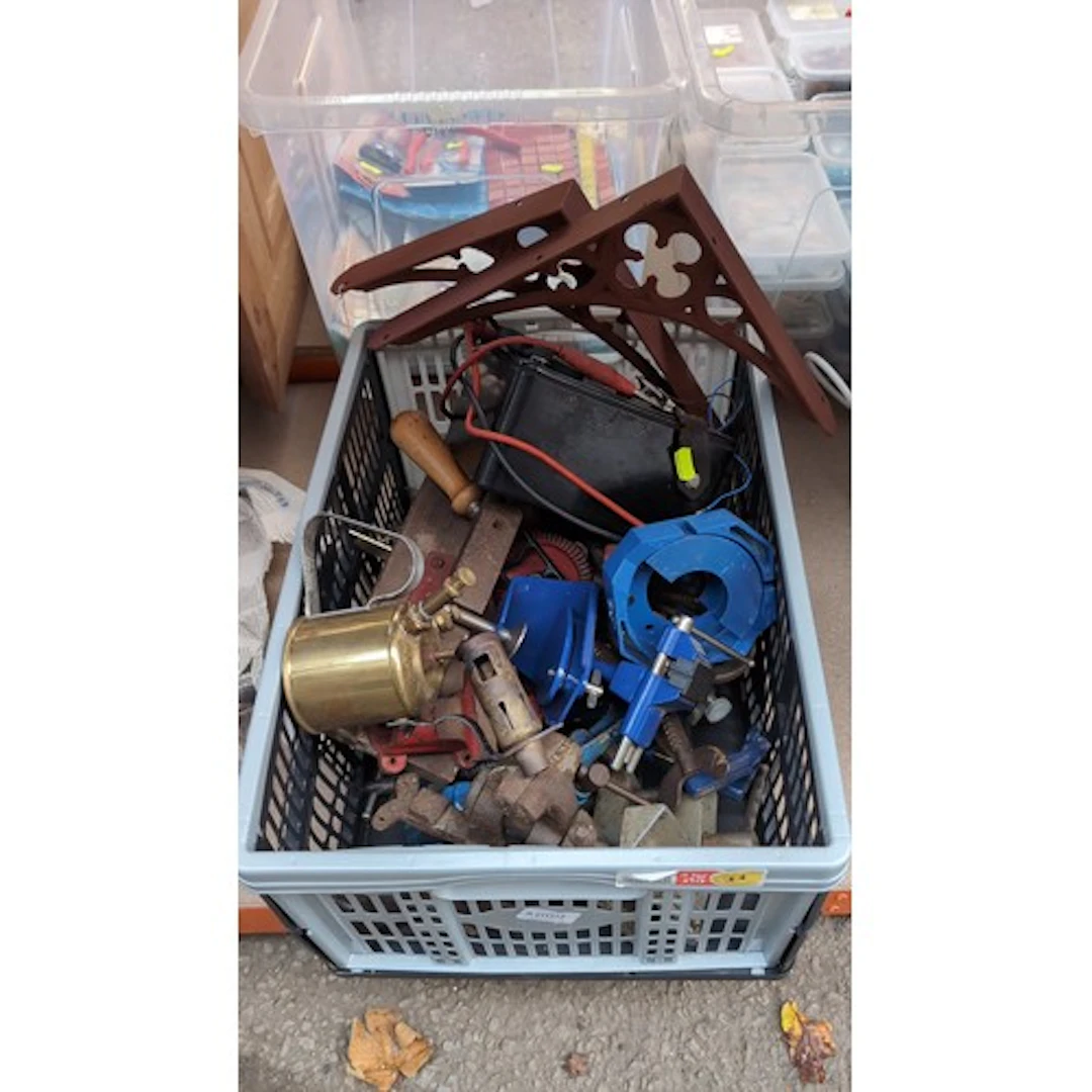 A collection of workshop equipment, including bench vices, p...