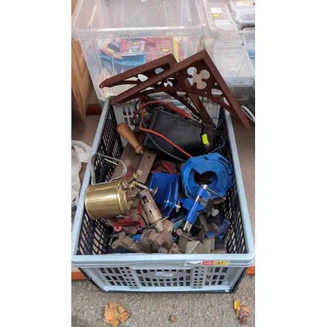 A collection of workshop equipment, including bench vices, p...