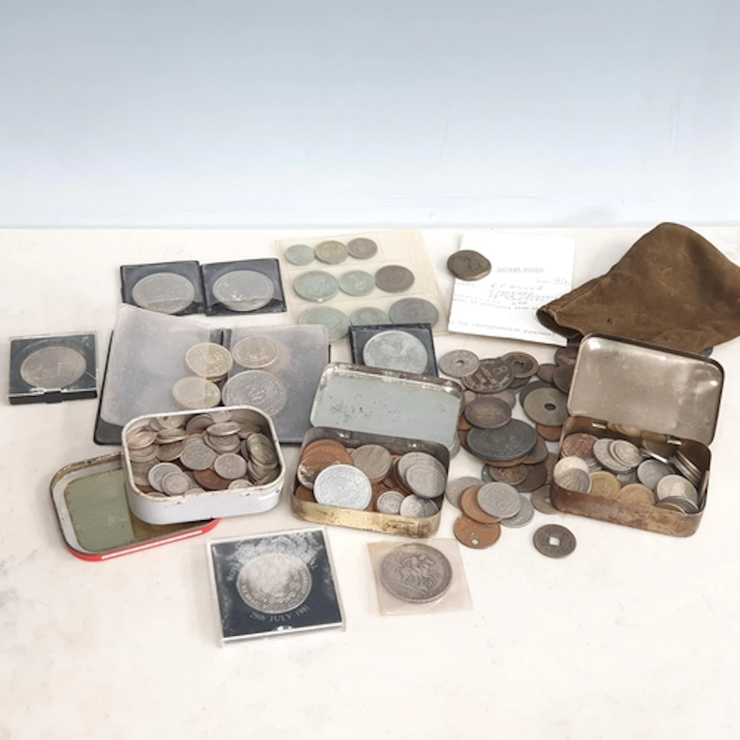 A tin box containing various Coins including; commemorative ...
