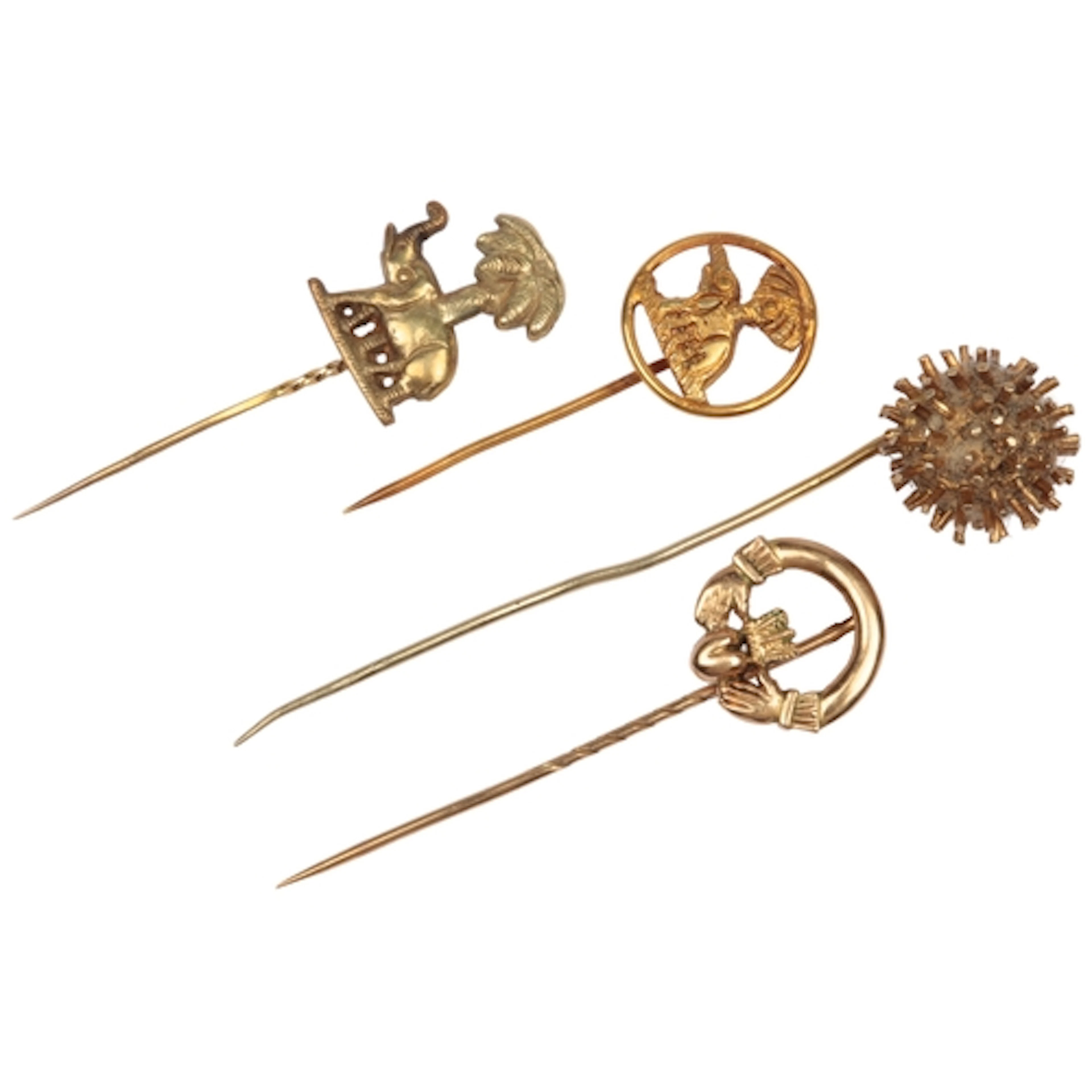 A collection of four stick pins, comprising: one of Claddagh...