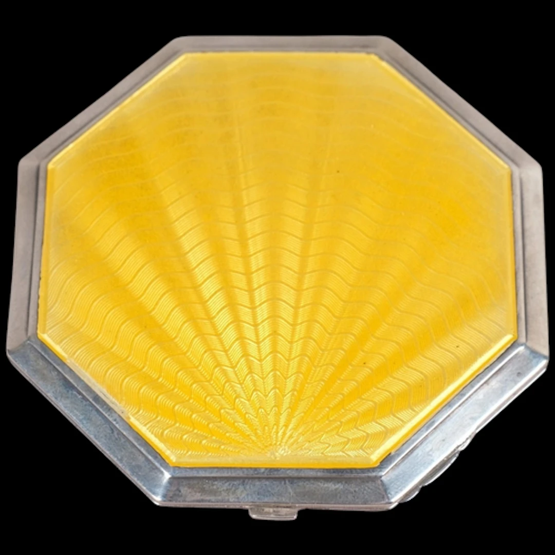 An Art Deco George V silver yellow enamel powder compact, Cr...