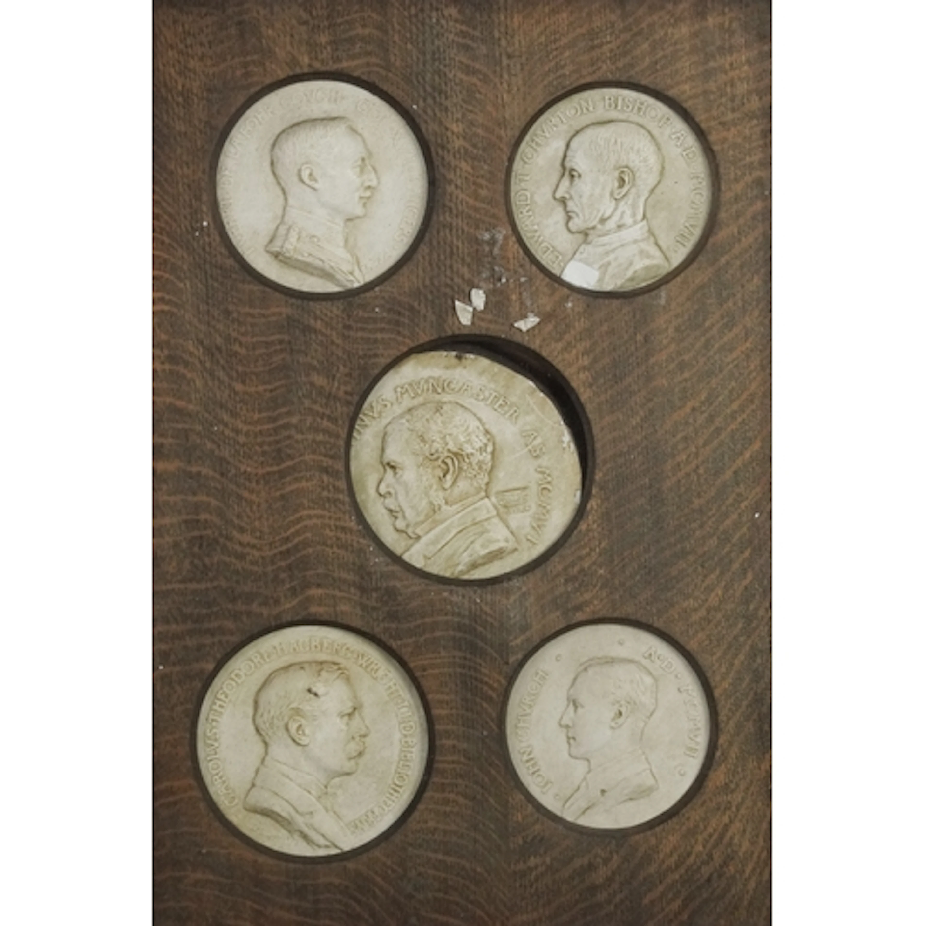 Early 20th century plaster plaques including Bishop Edward T...