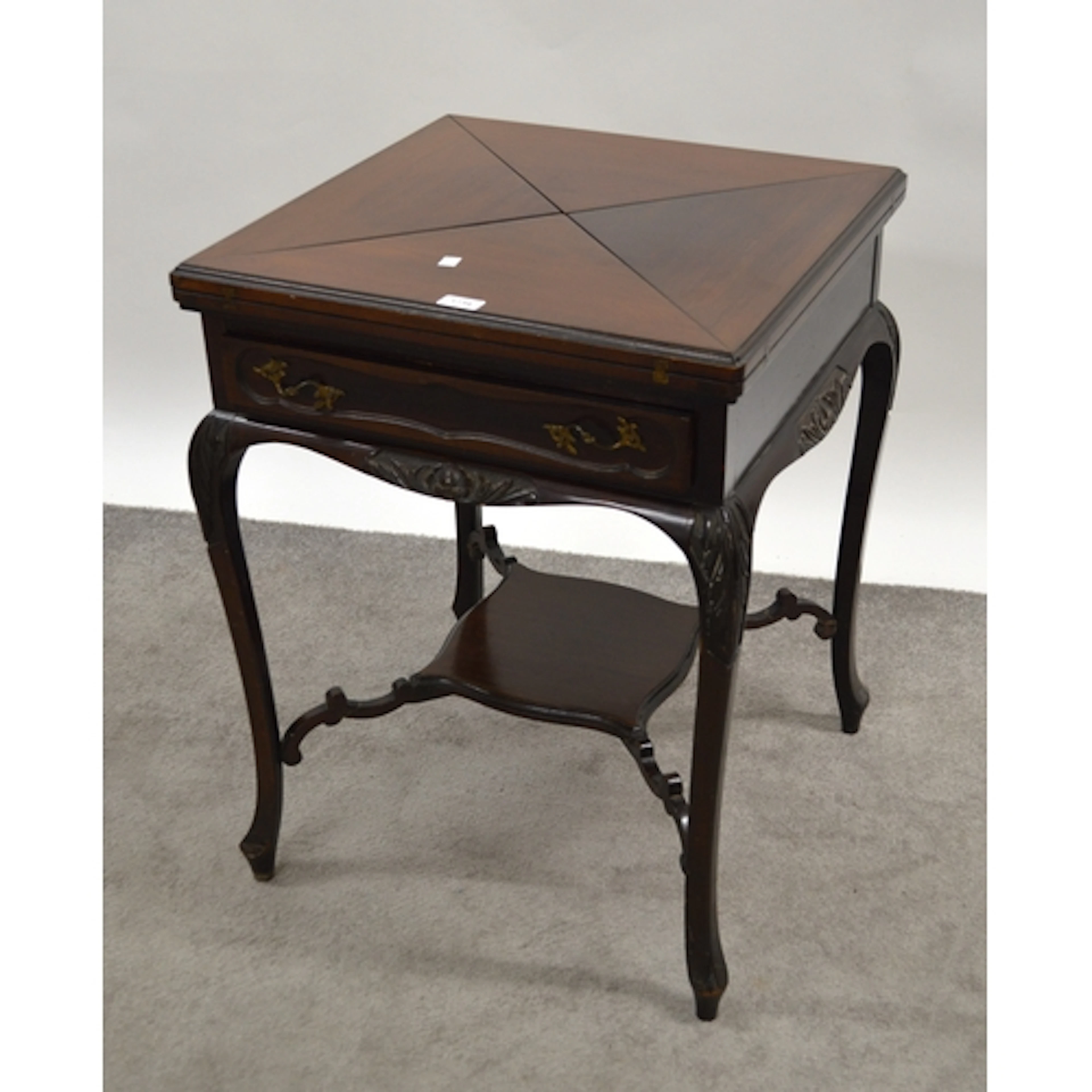 Edwardian mahogany square envelope card table, on cabriole s...