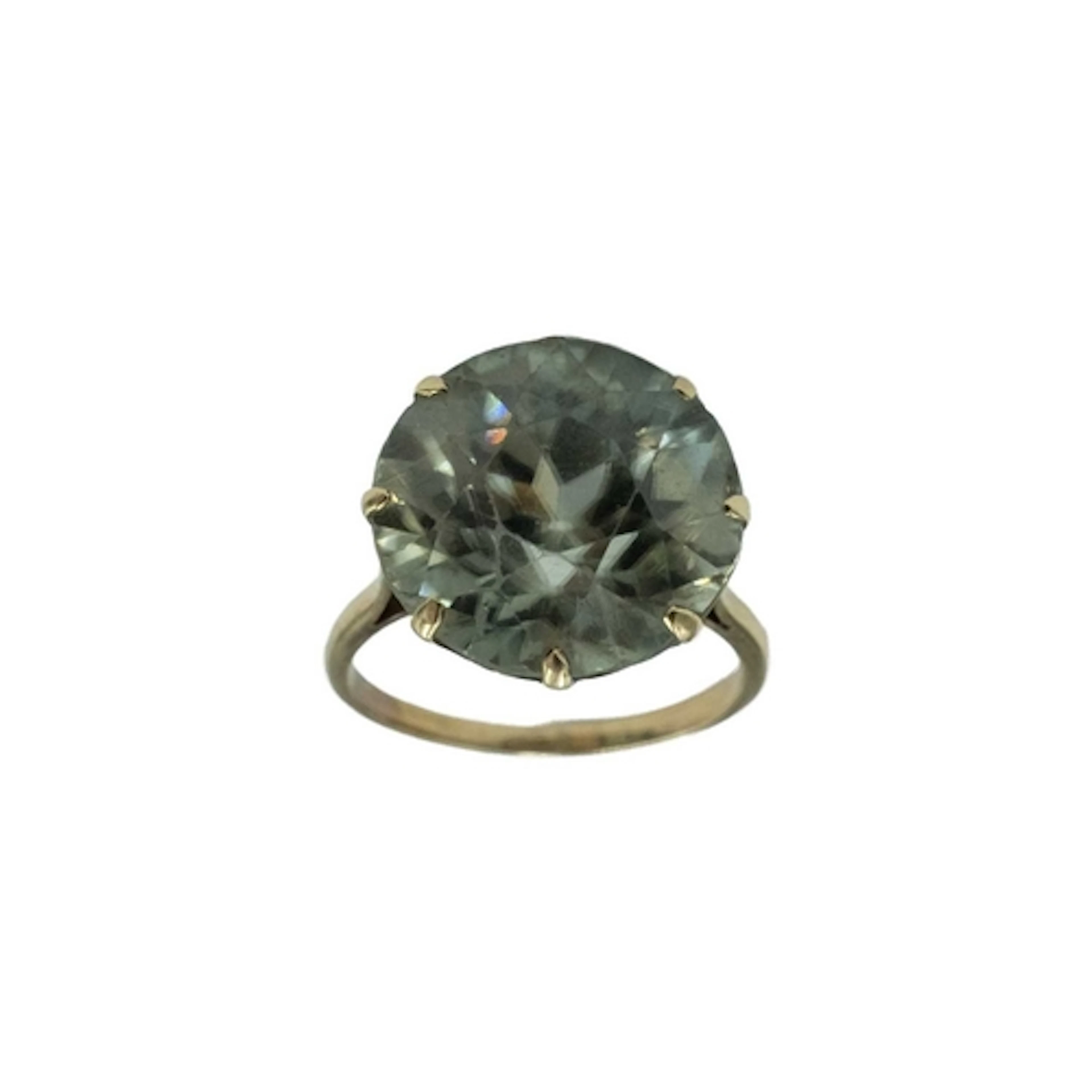 A pale green round-cut zircon cocktail ring, set in yellow g...