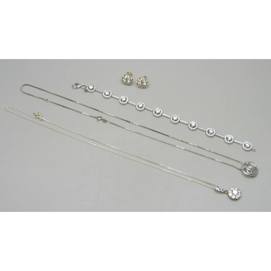 A collection of silver jewellery including a cubic zirconia ...
