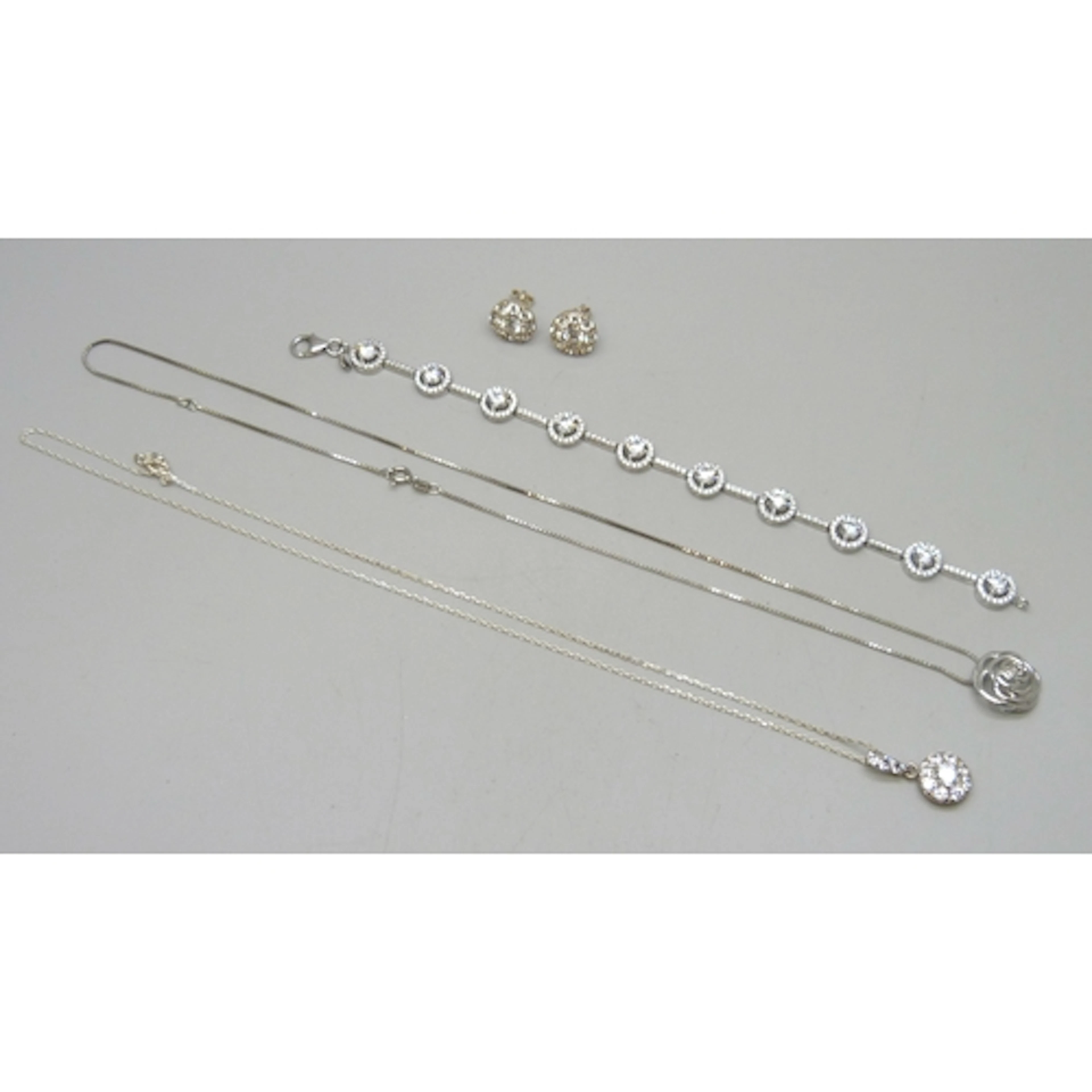 A collection of silver jewellery including a cubic zirconia ...