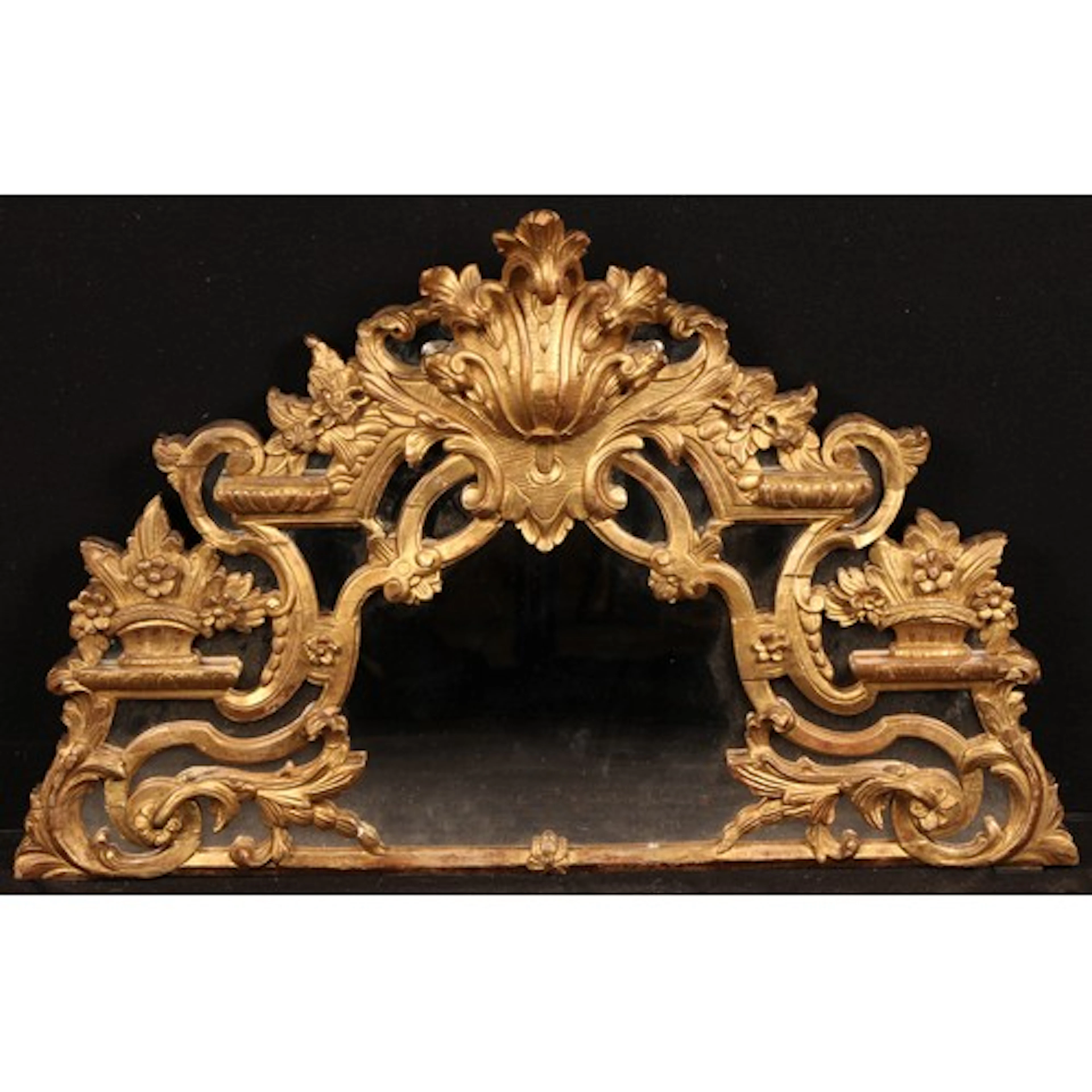 A Rococo Revival giltwood and gesso architectural mirrored d...