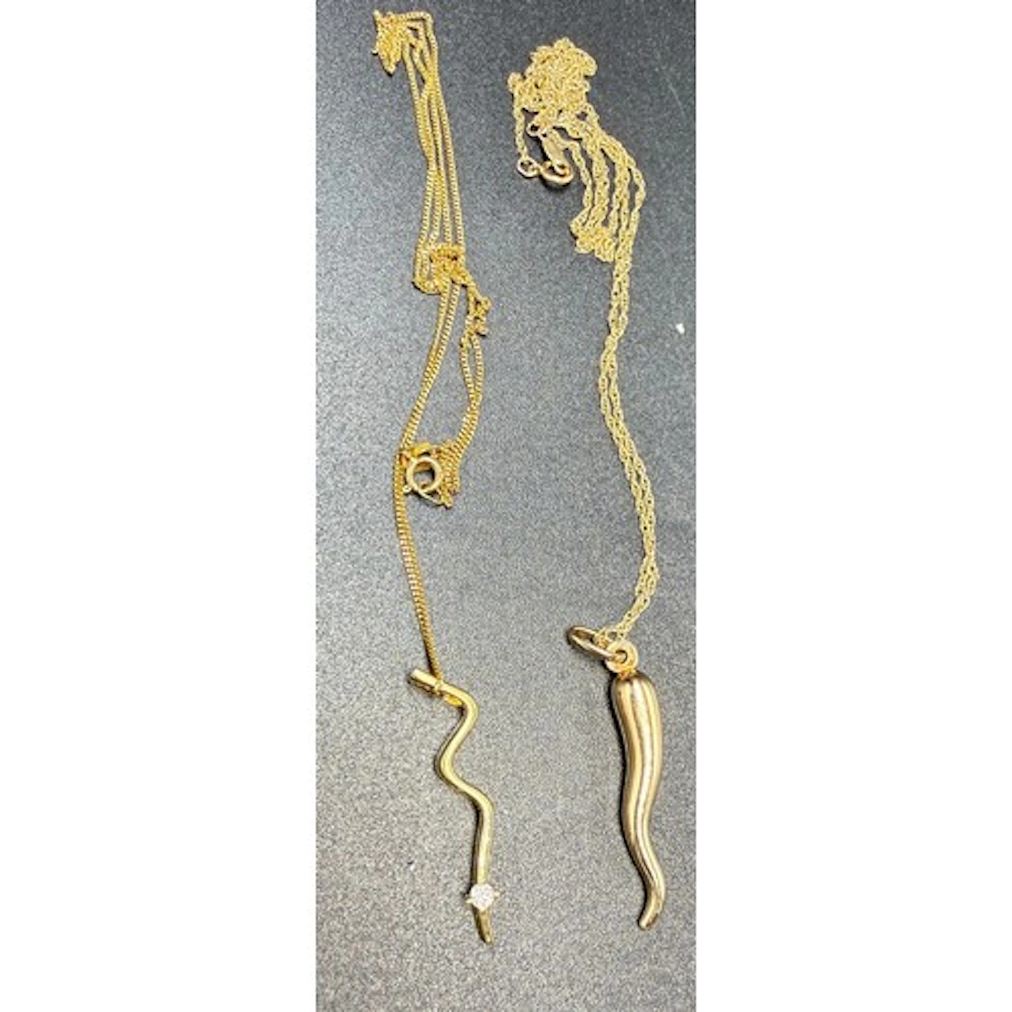 Two gold pendant necklaces, one 9 carat and the other 18 car...