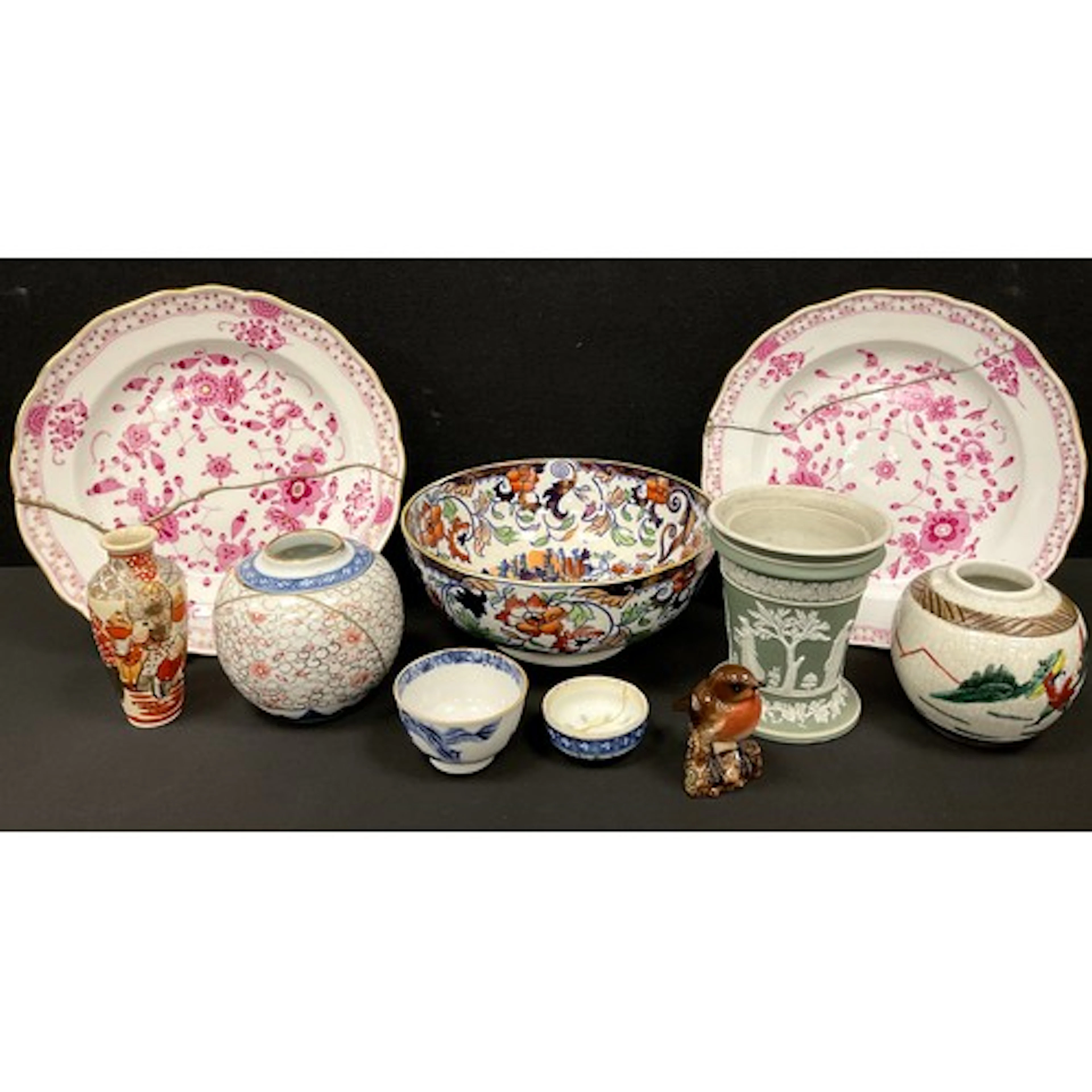 Ceramics - a Wedgwood green jasperware urn, decorated with c...