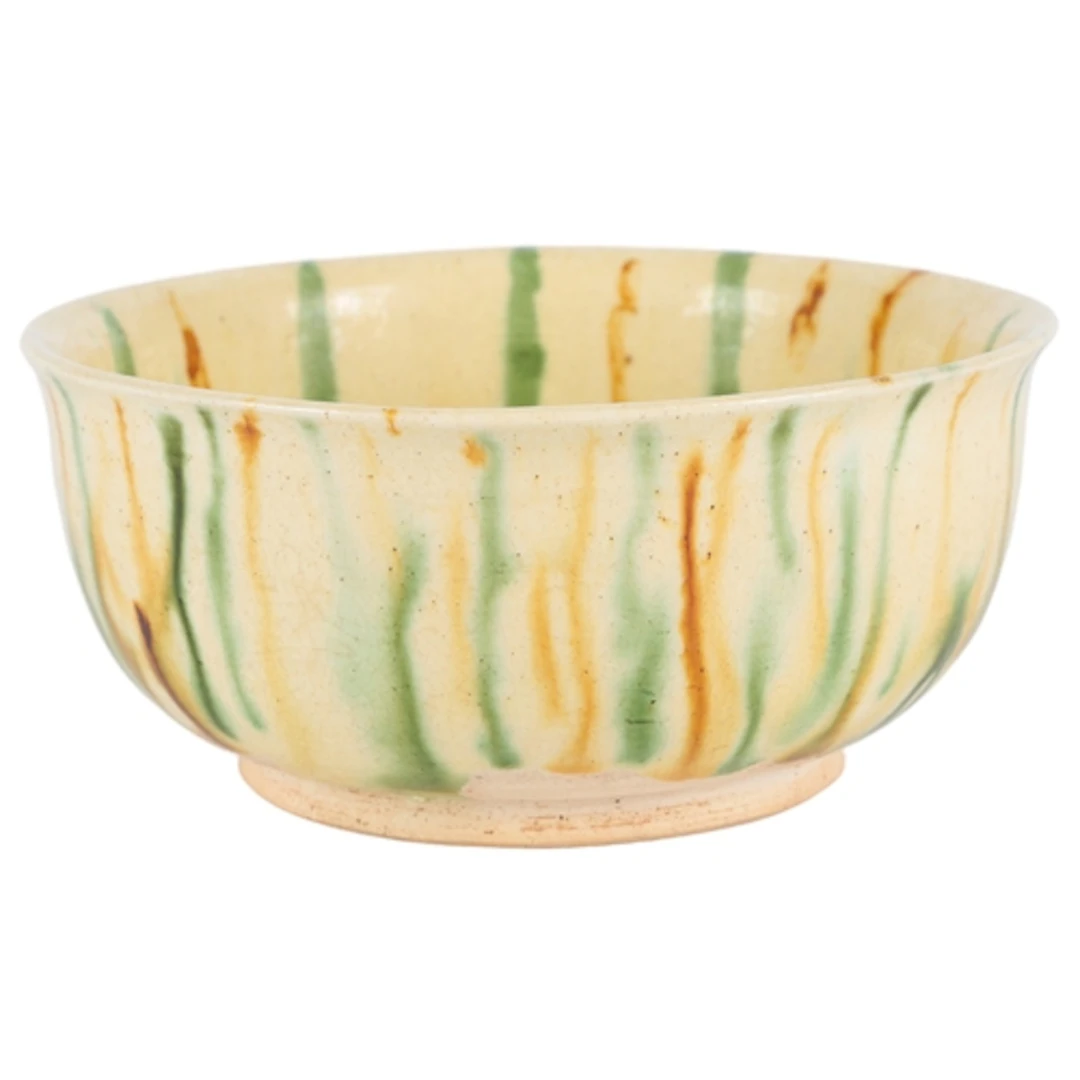 A Chinese sancai bowl, possibly Tang period, partially glaze...