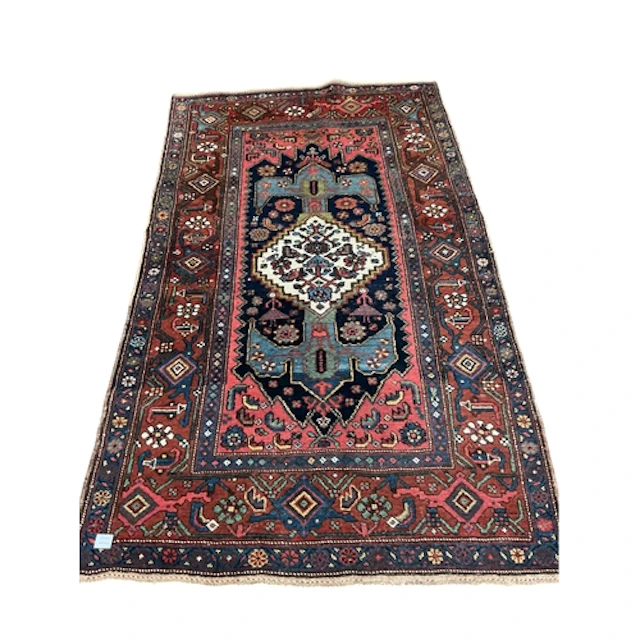 A North West Persian rug, 208cm x 121cm