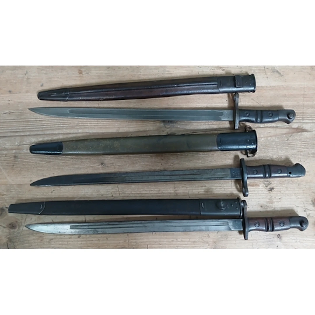 A group of three US Remmington bayonets.