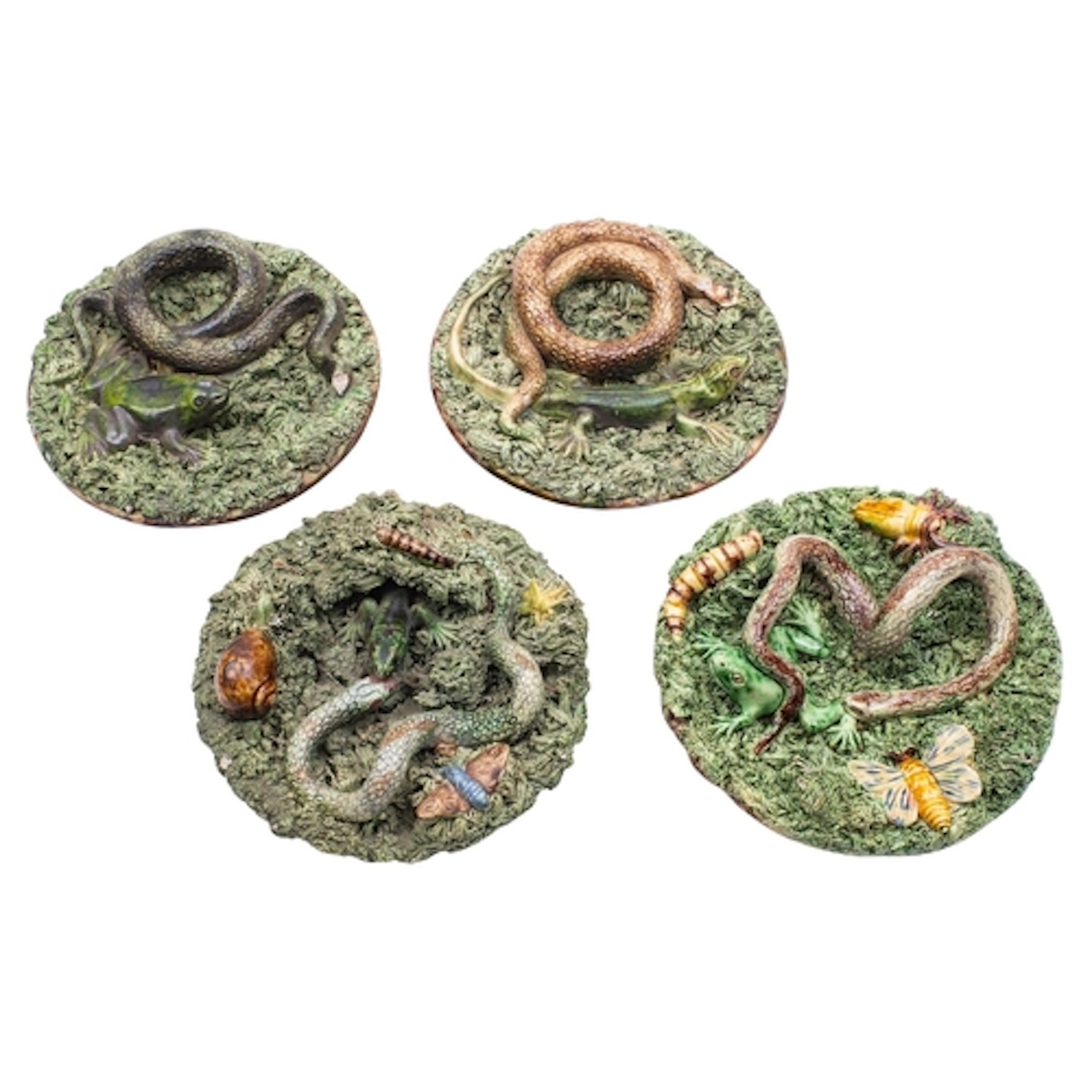 Four small Portuguese Palissy ware dishes two by Jose Franci...