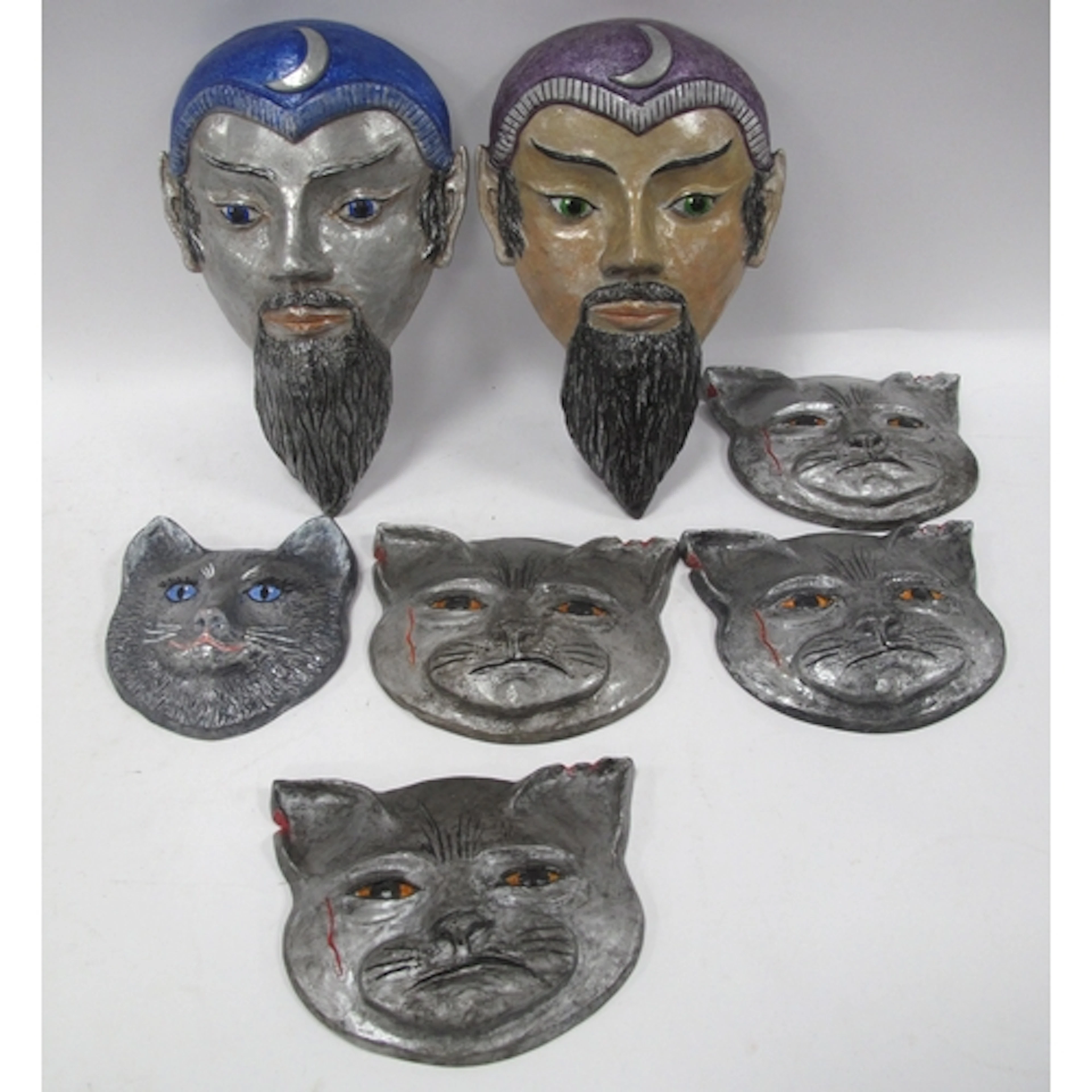 Seven limited edition studio pottery wall plaques/masks by J...