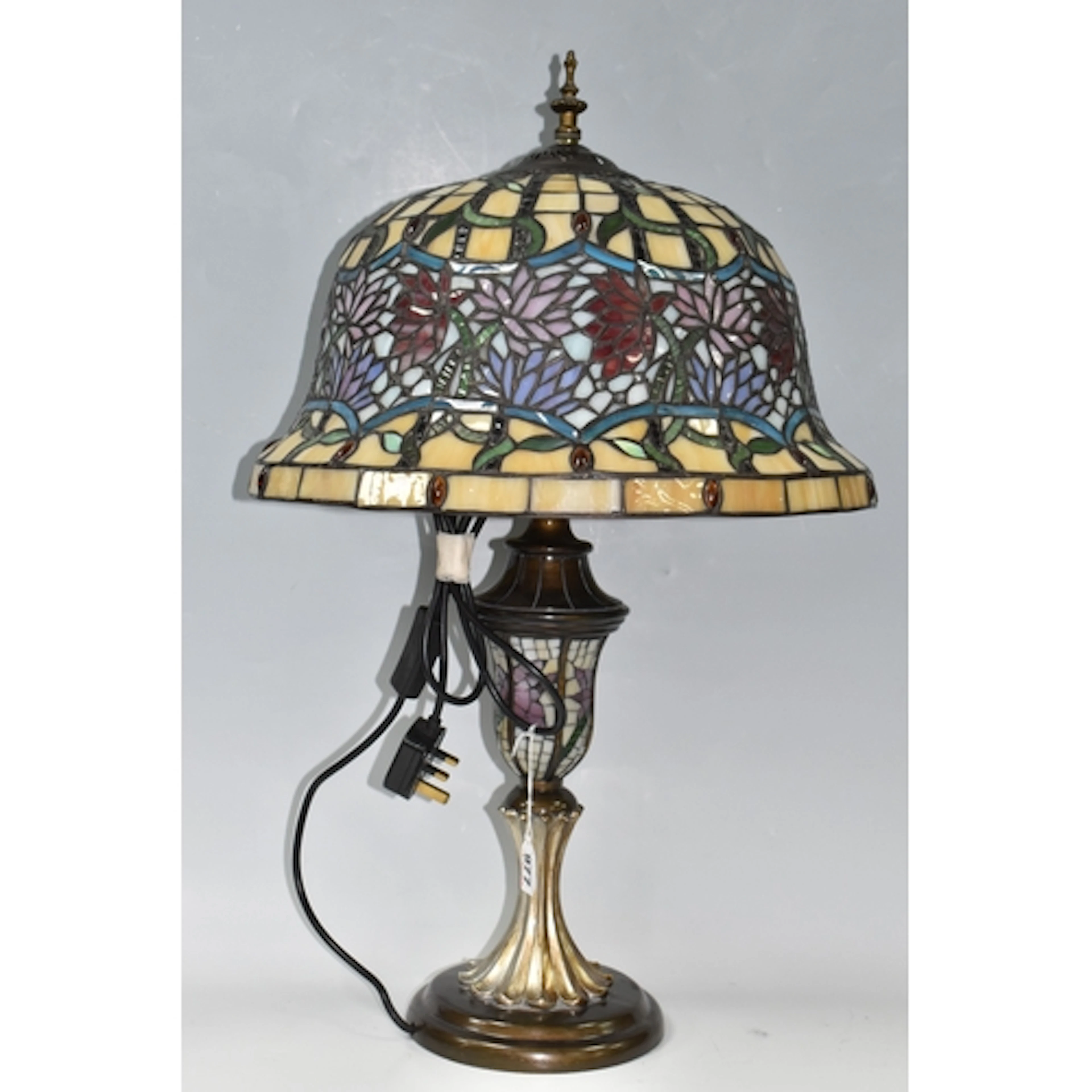 A TIFFANY STYLE TABLE LAMP, featuring a large wide bell shap...