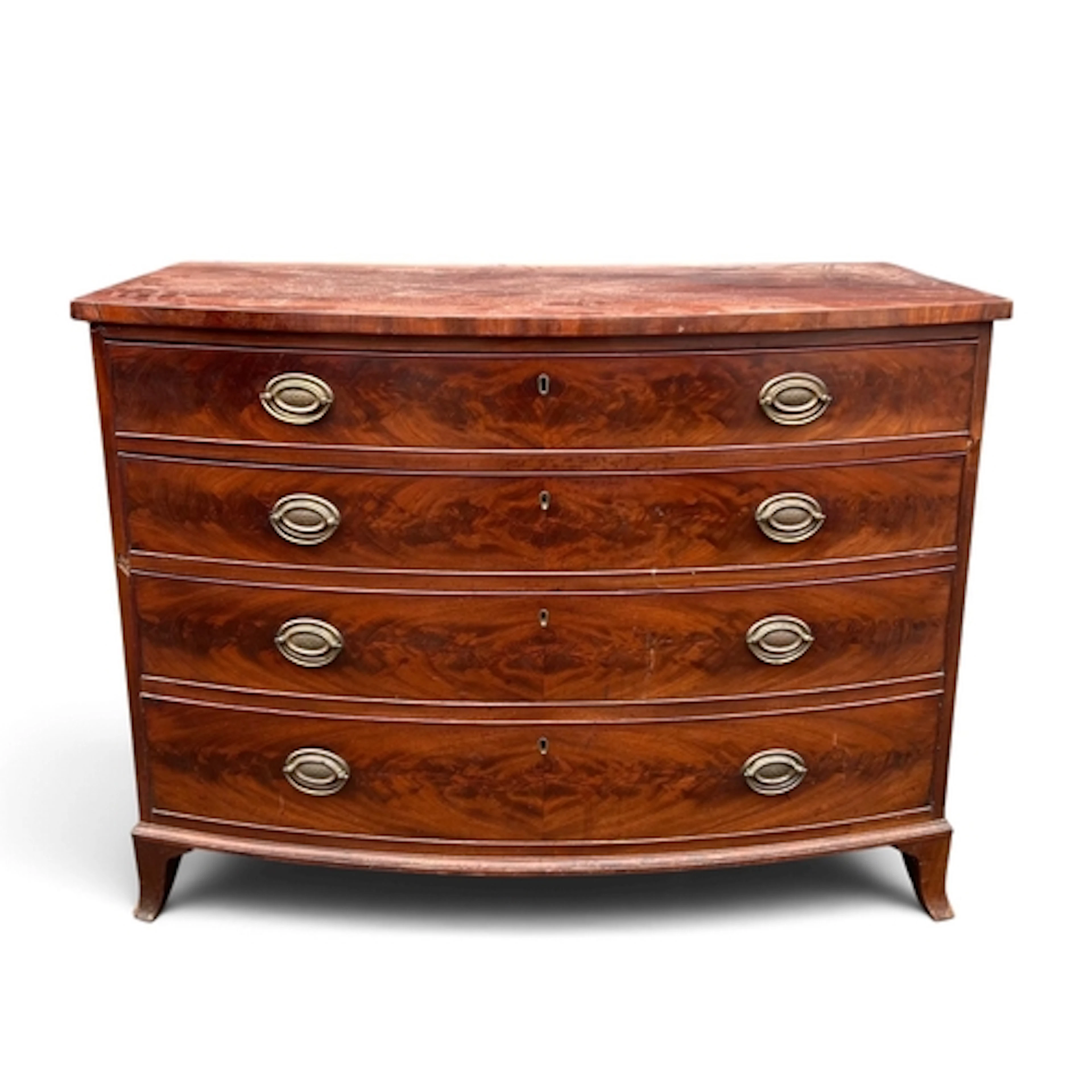 A GEORGIAN MAHOGANY BOWFRONTED CHEST OF FOUR GRADUATED DRAWE...
