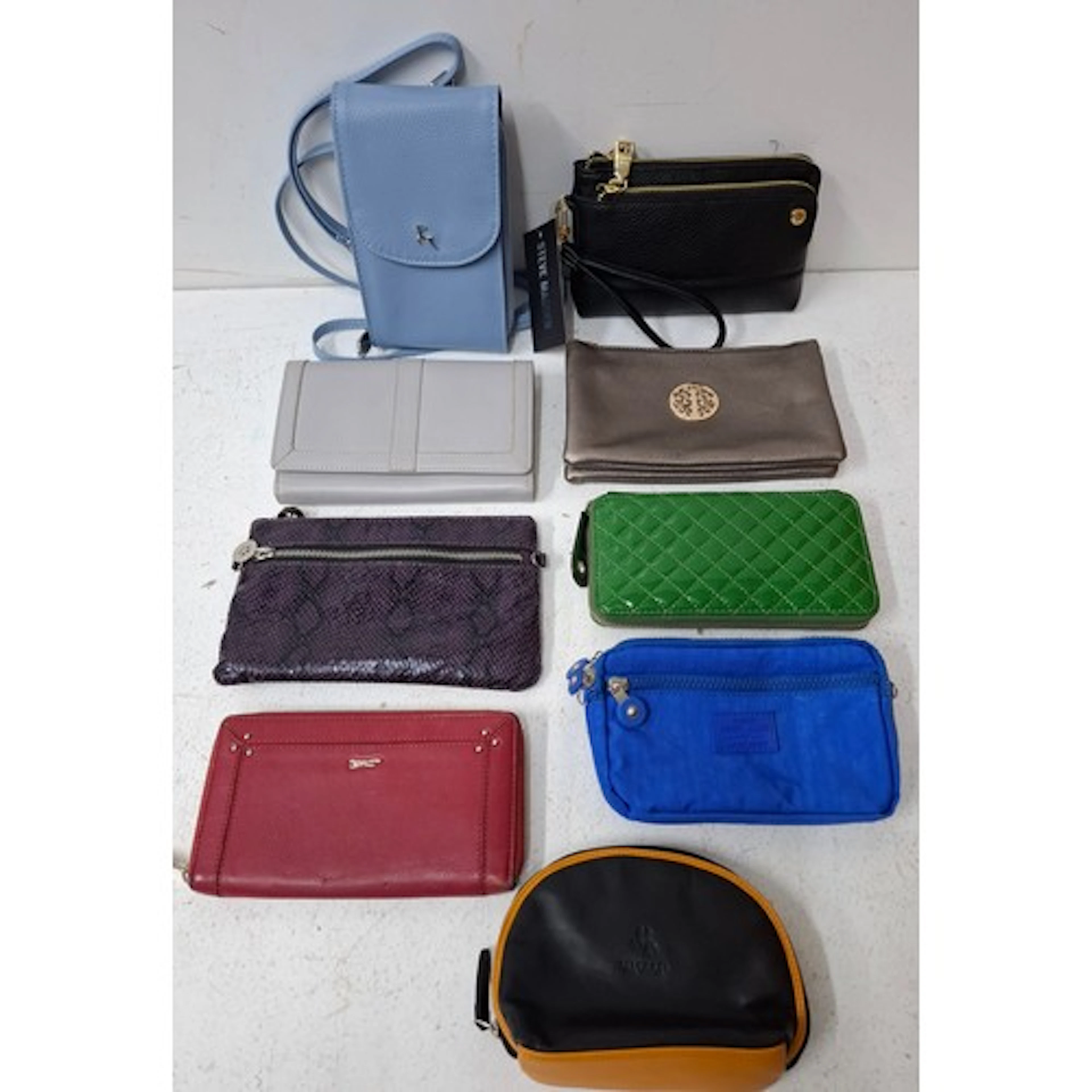 A group of modern fashion travel and occasional bags togethe...