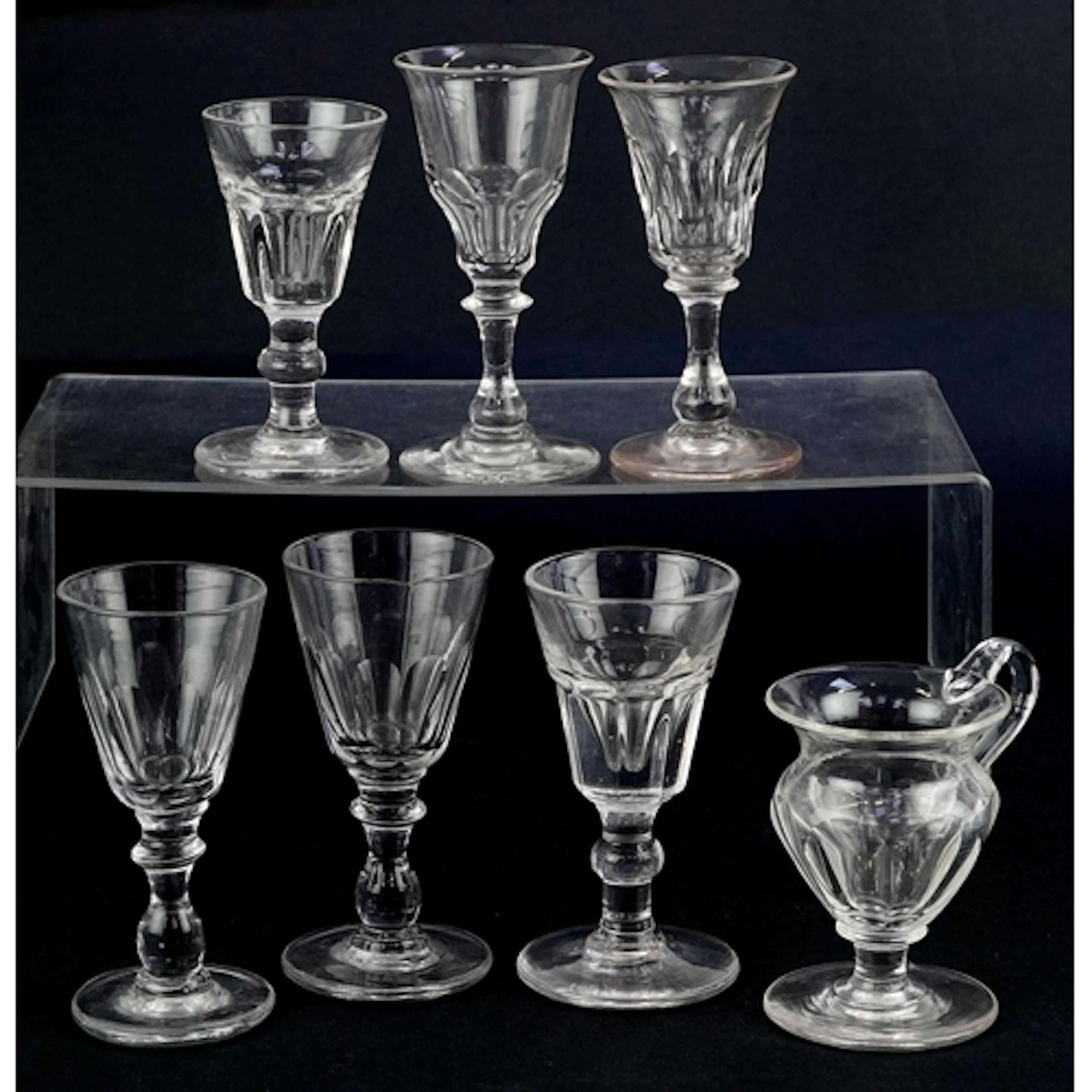 Seven antique liquor glasses, the largest 12.5cm high.