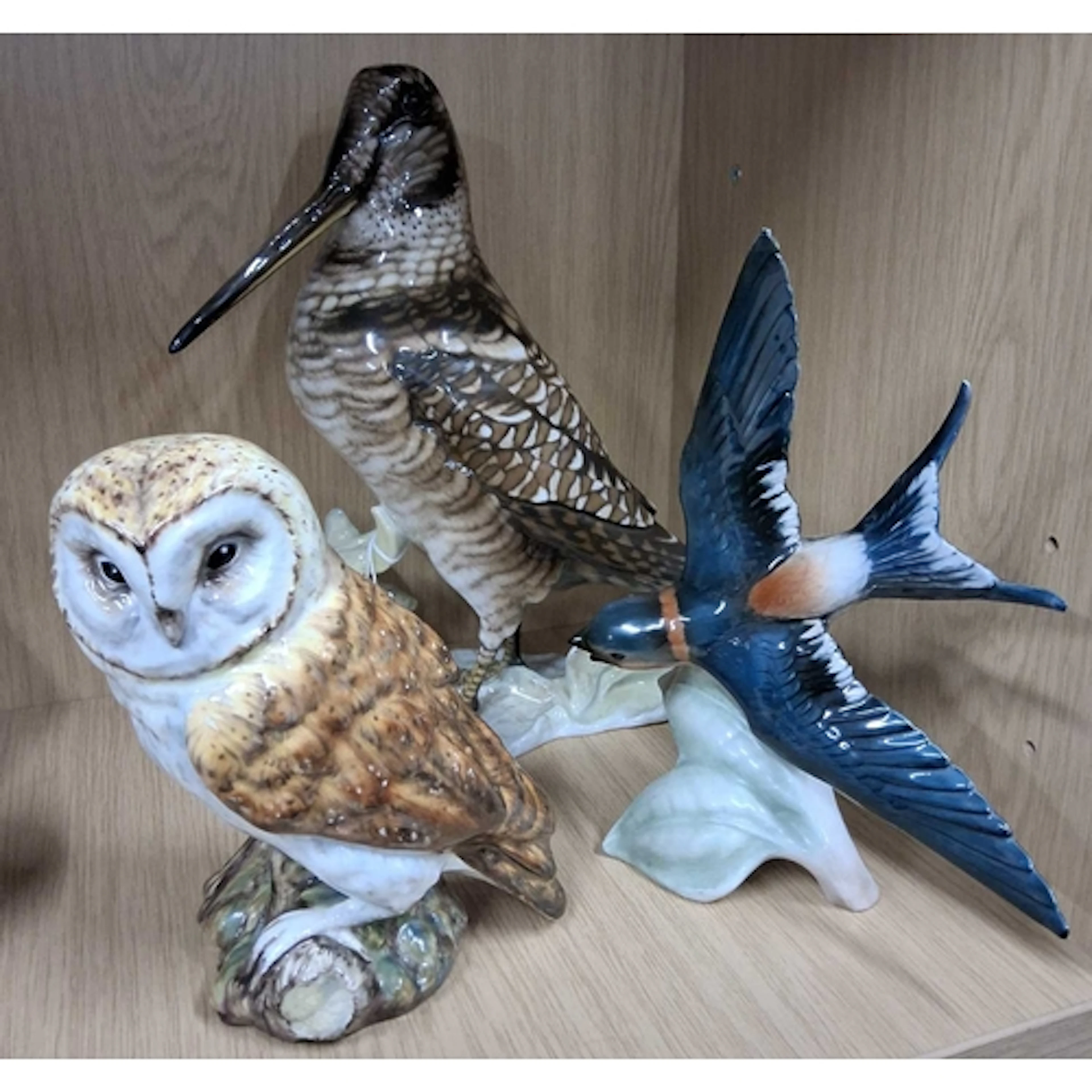 A GROUP OF CERAMIC BIRDS, comprising a Rosenthal Snipe, mode...