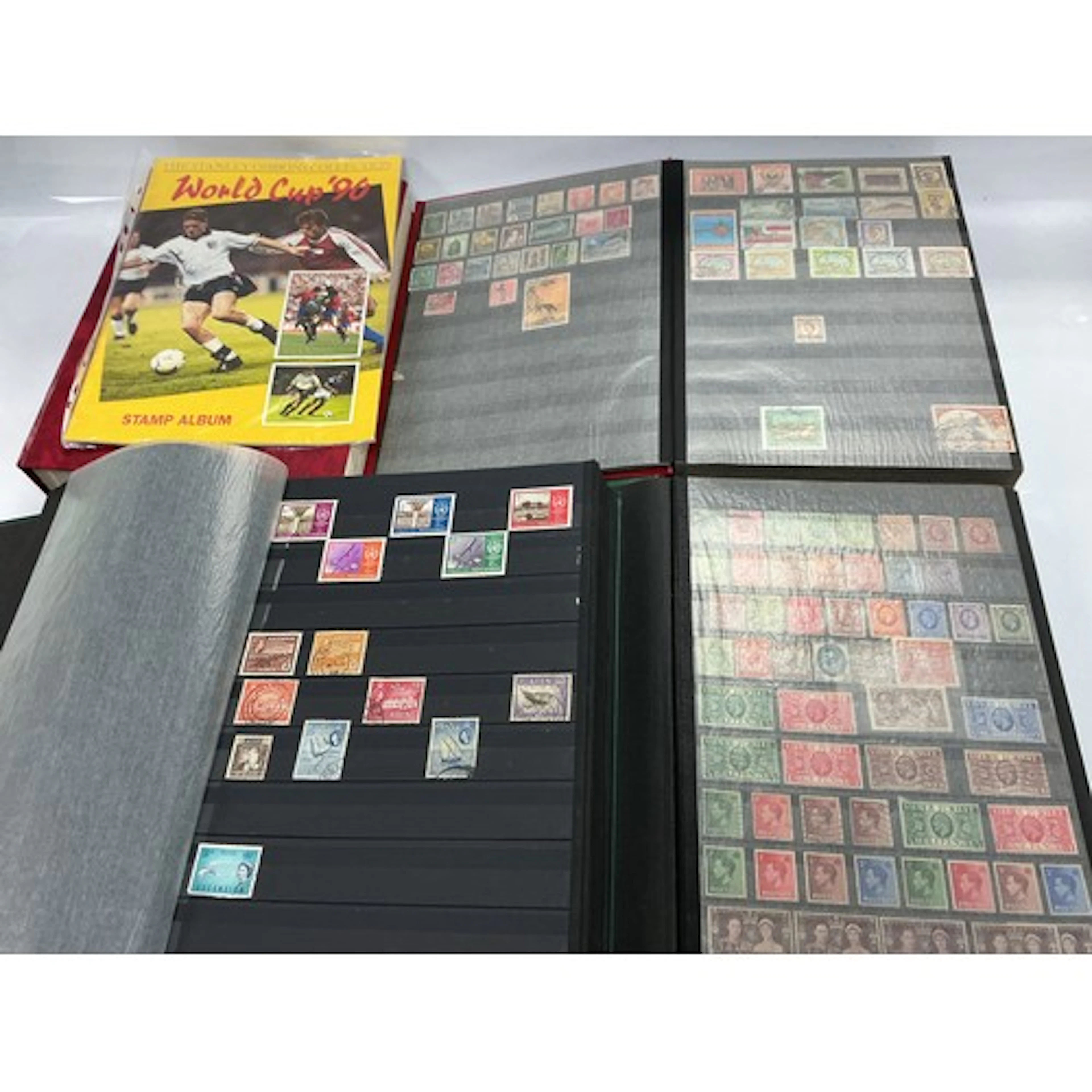 A collection of GB and world stamps in binders.