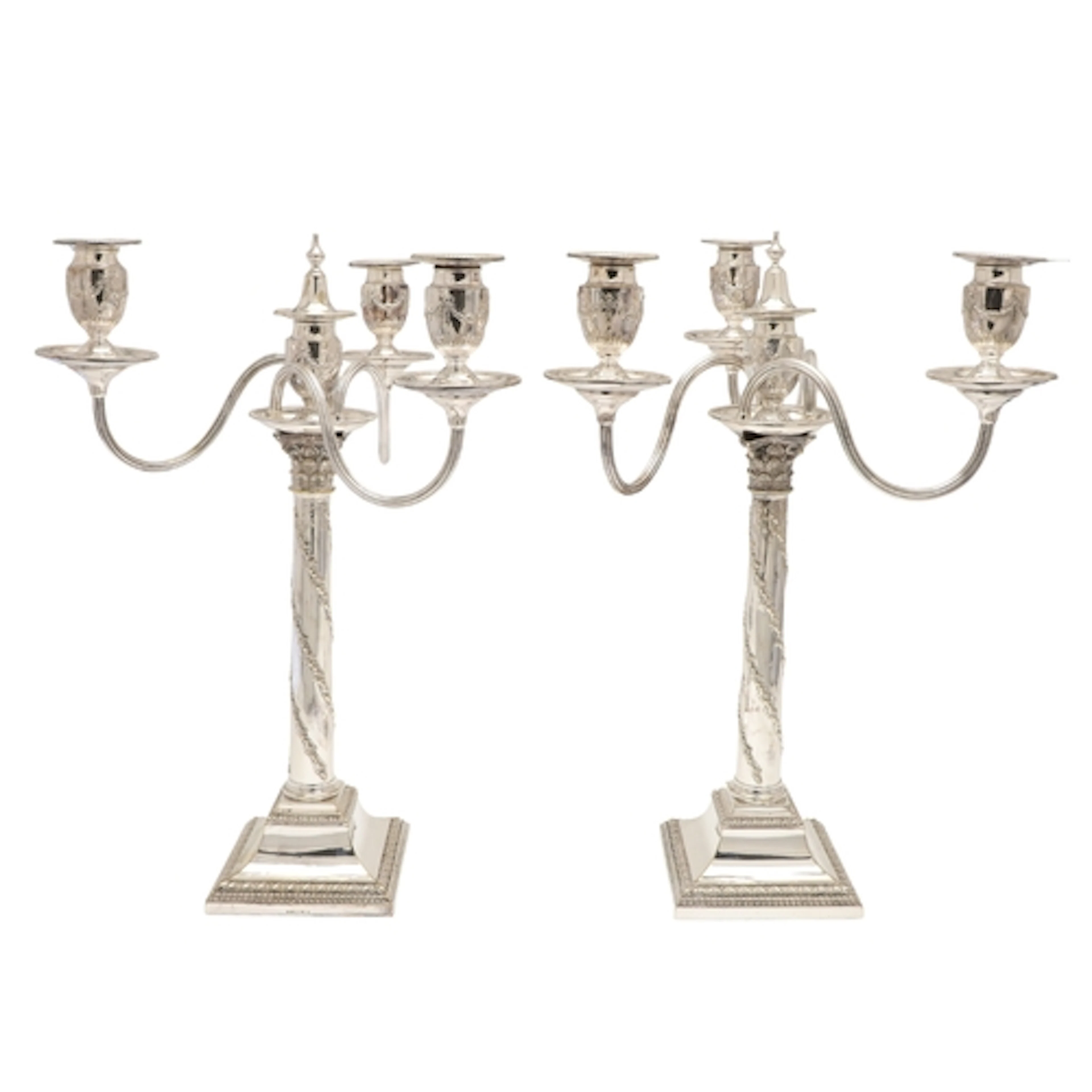 A PAIR OF SILVER PLATED THREE BRANCH CANDELABRA. The tops ma...