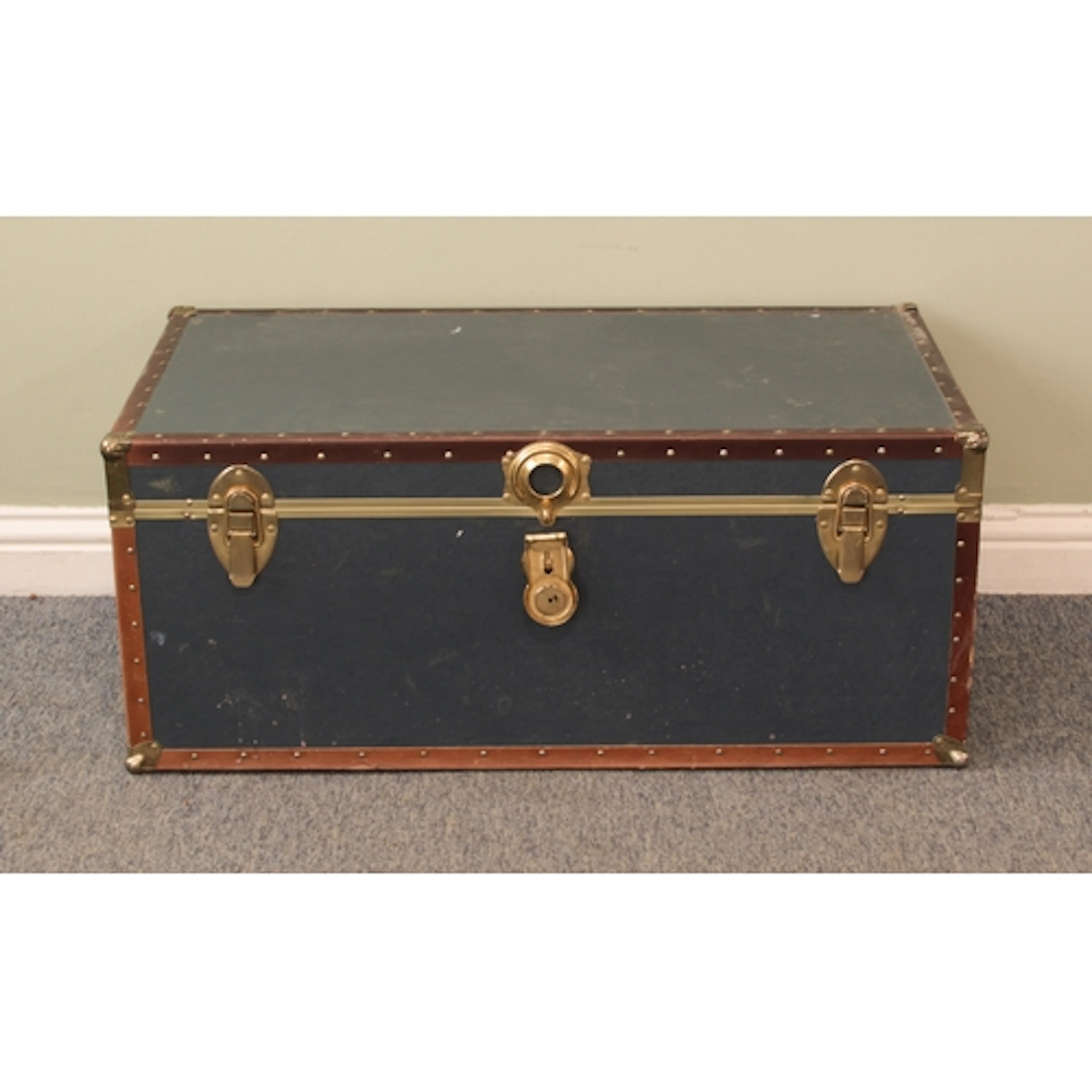 A vintage school or steamer trunk - in blue with faux-leathe...