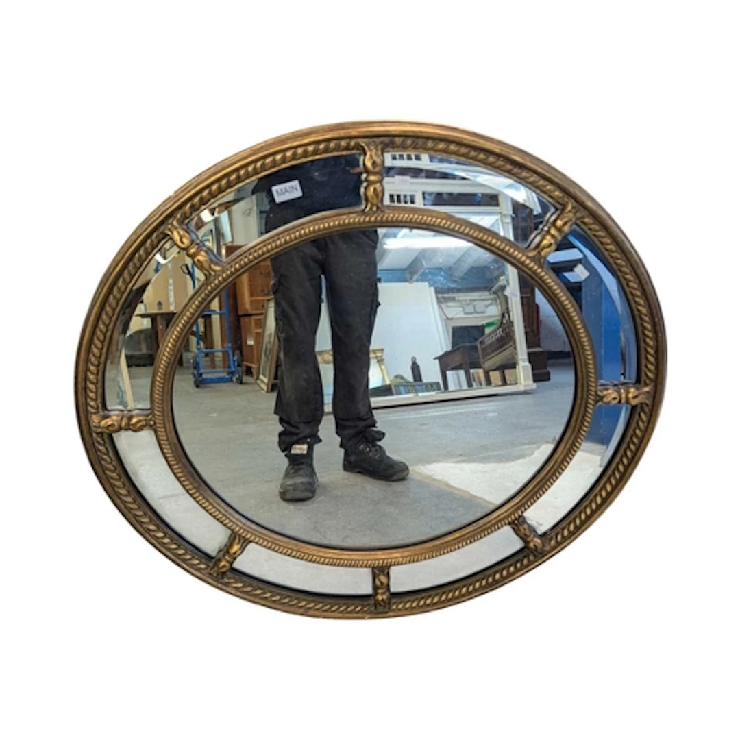 A large oval reproduction sectional large wall mirror. Of Ve...