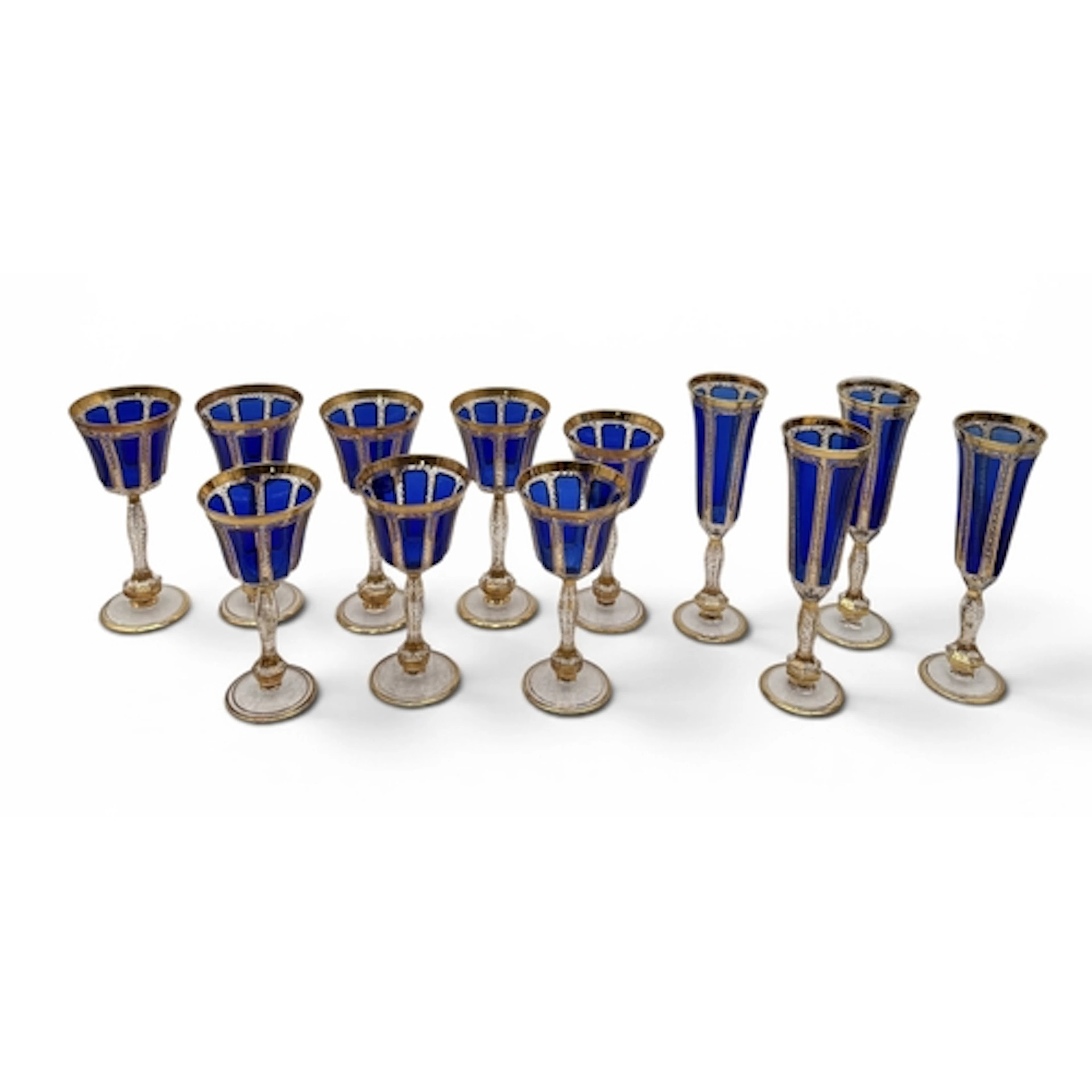 A SET OF TWELVE MOSER STYLE BOHEMIAN COBALT BLUE AND GILT GL...