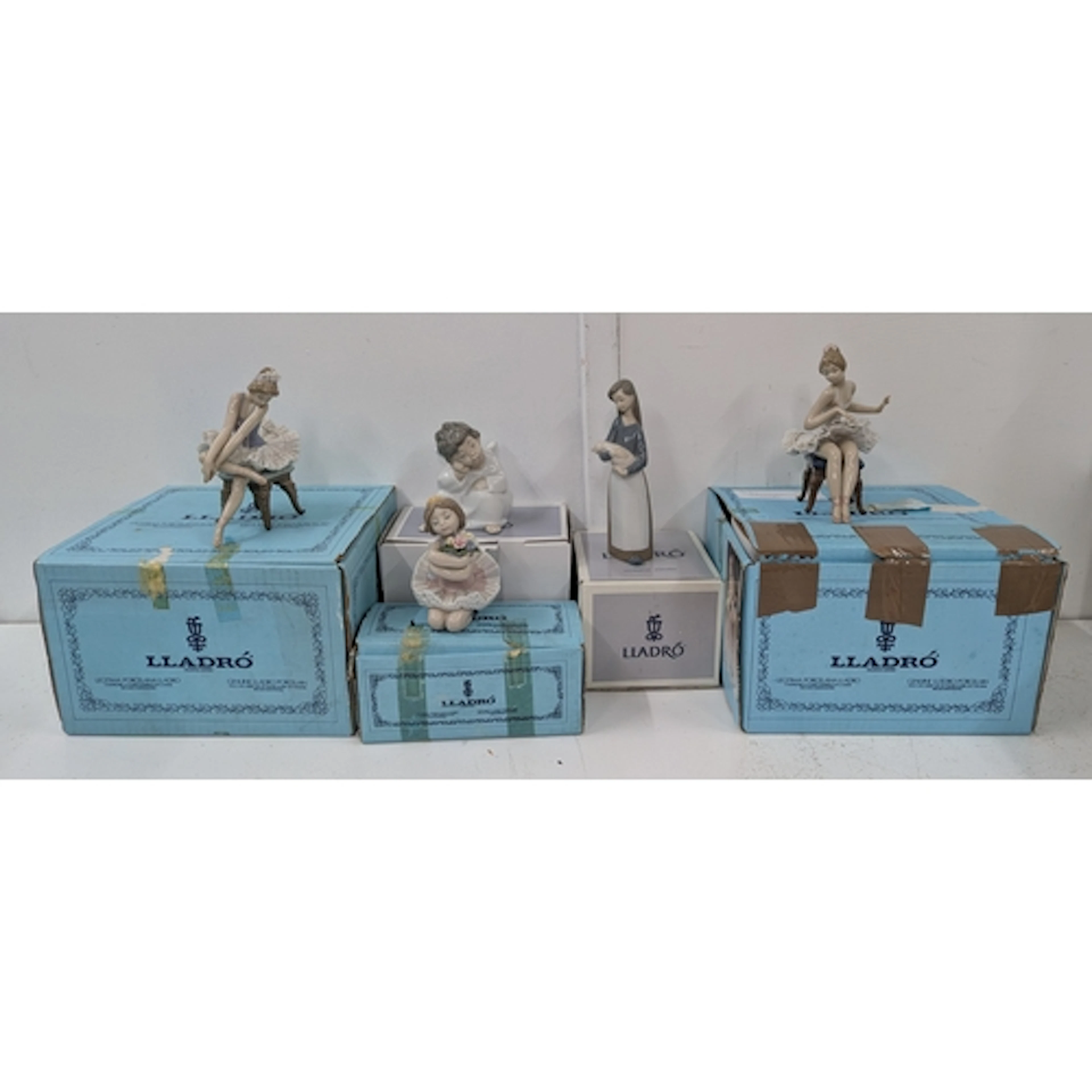 Five boxed Lladro models to include a young girl holding a p...