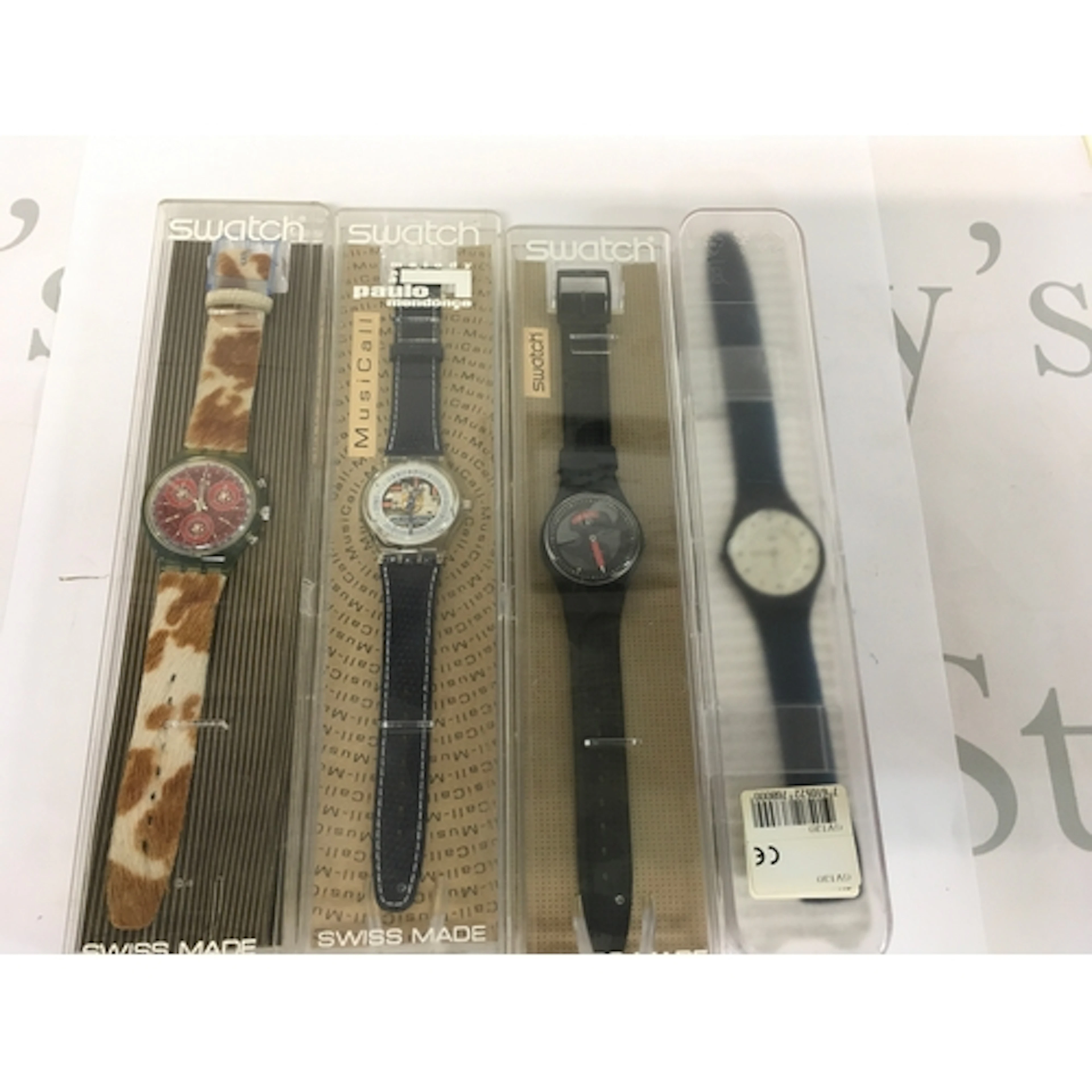 Four vintage Swatch watches come in their original blis...