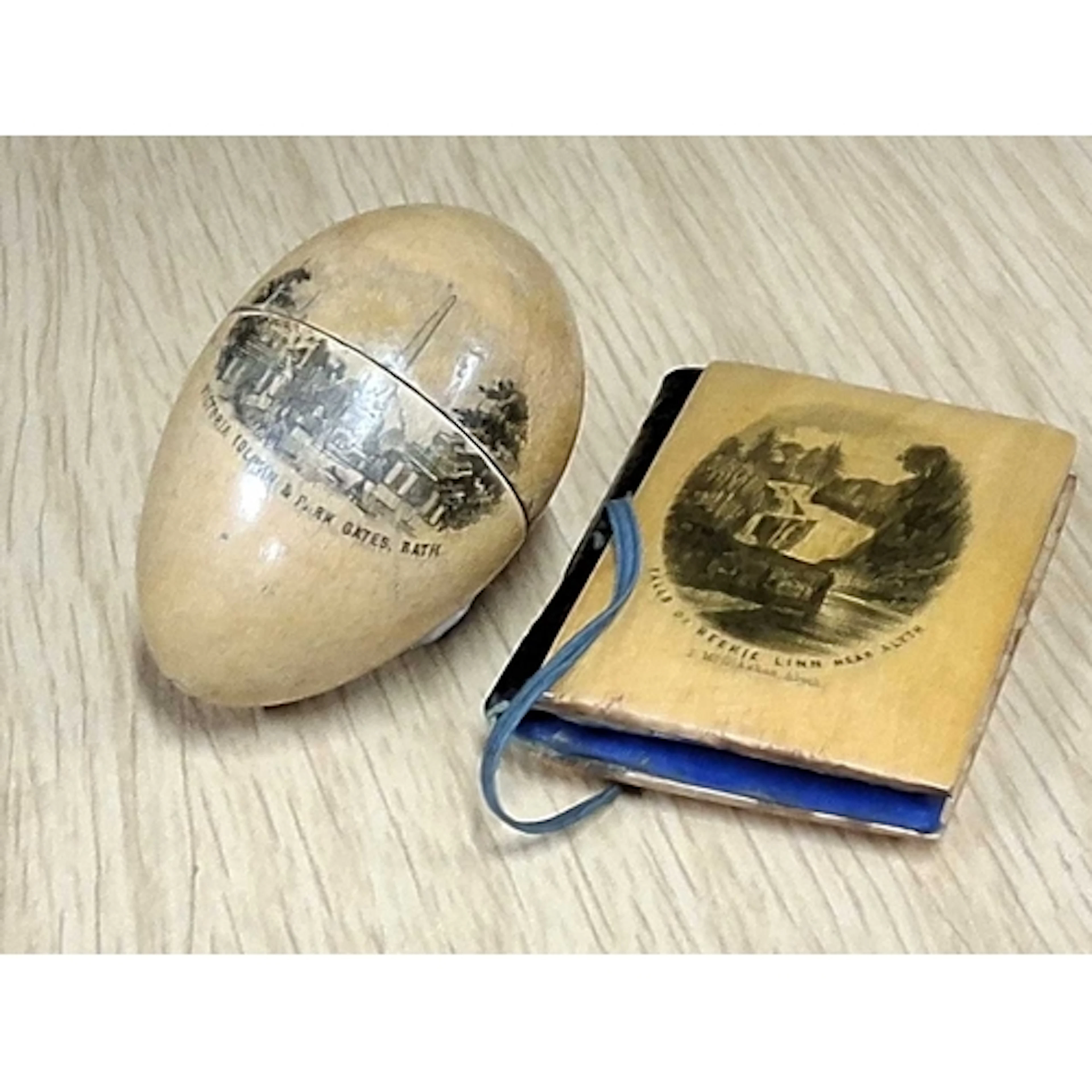 TWO MAUCHLINE WARE SEWING CASES, comprising an ovoid thimble...
