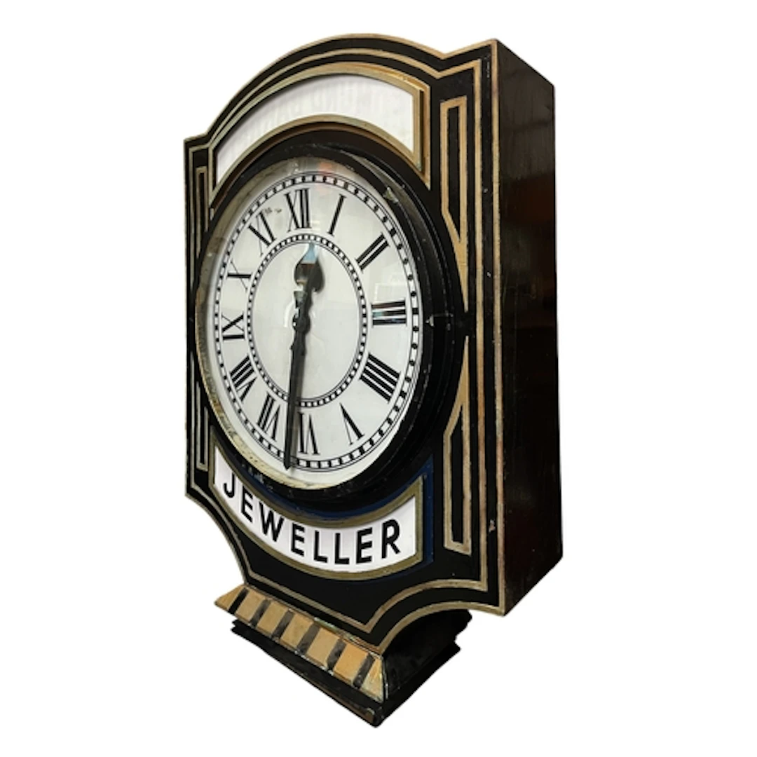 An impressive early 20th century black & gilt painted metal ...