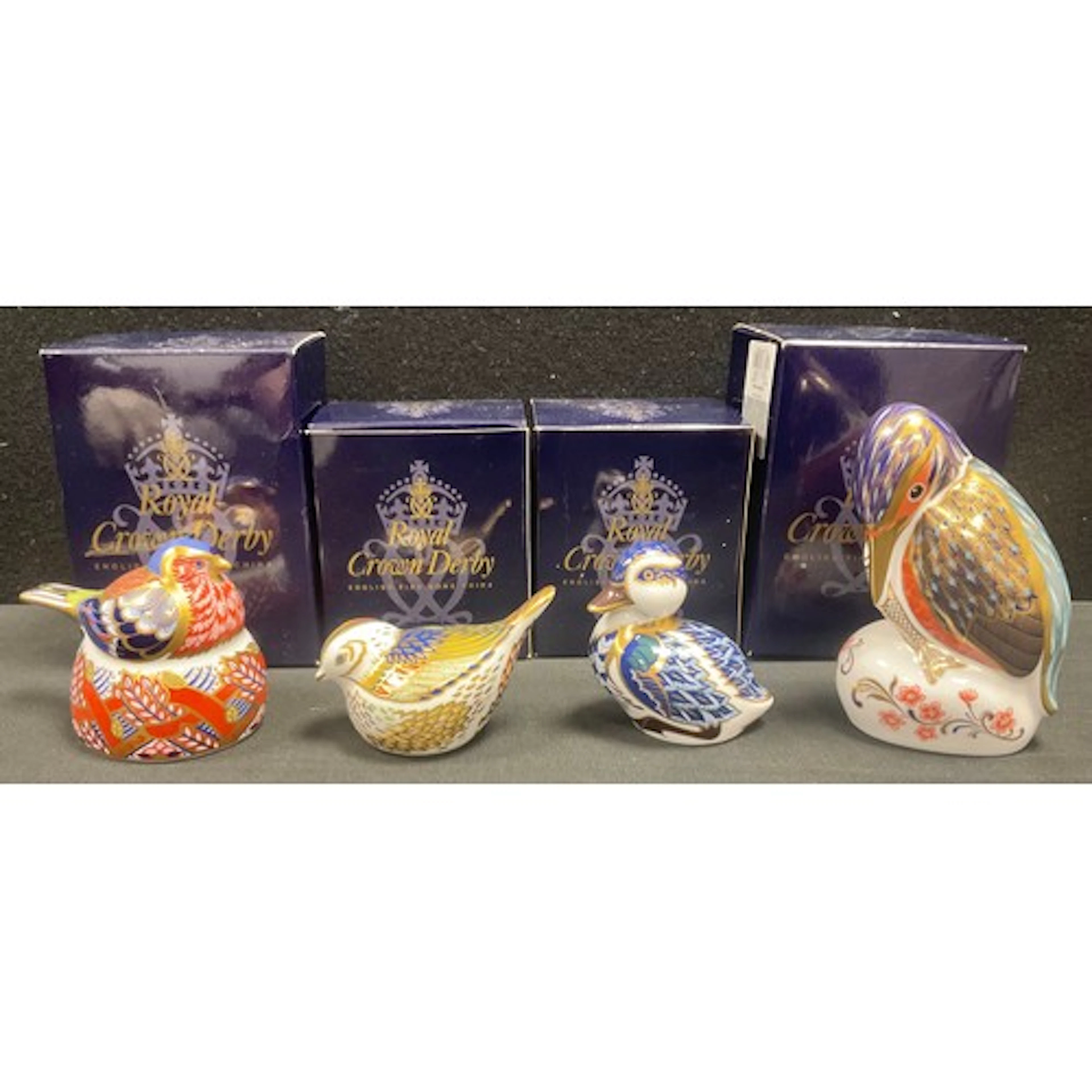 Four Royal Crown Derby paperweights including Kingfisher, Fi...