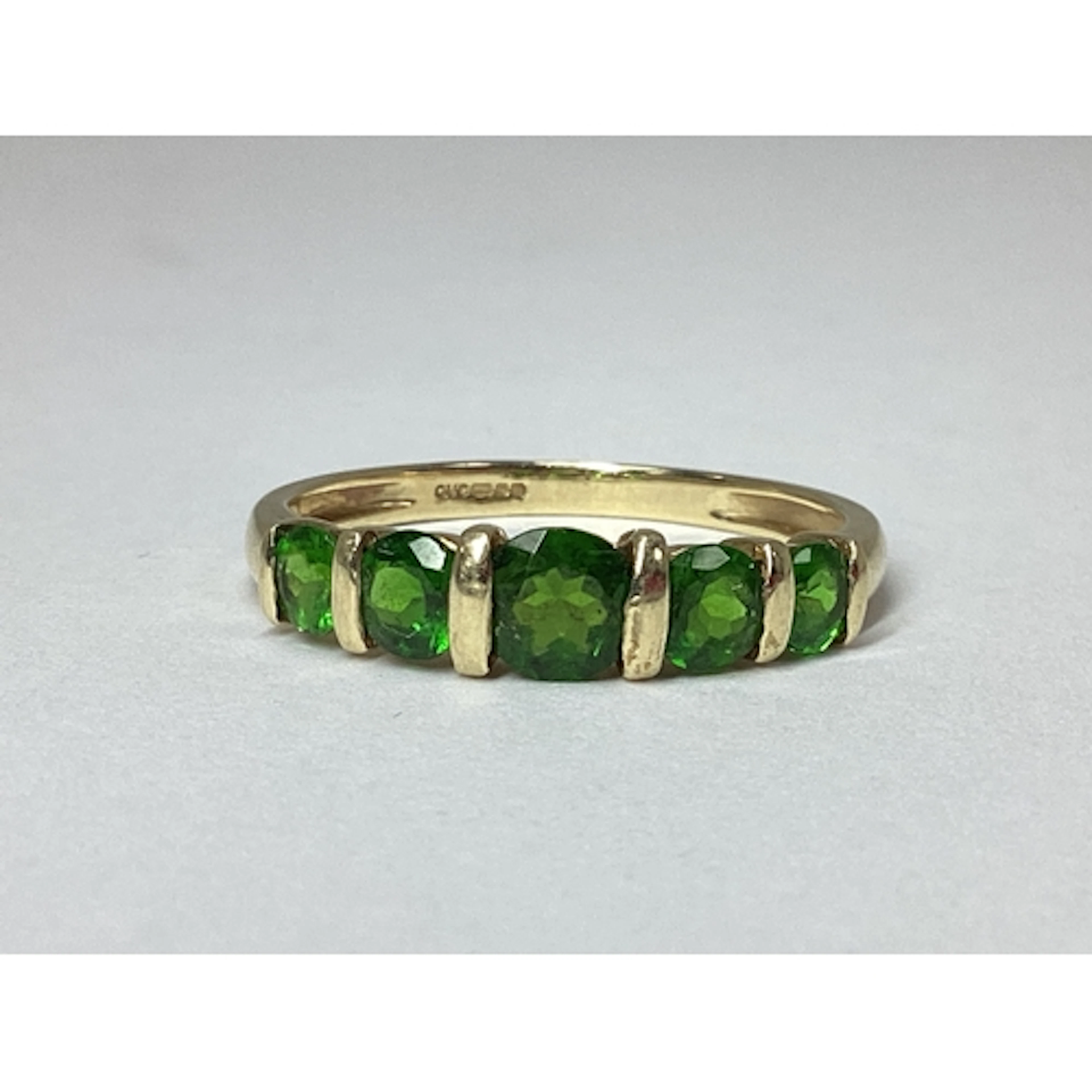 QVC; A 9ct Gold Graduated Five Stone Ring, tension set throu...