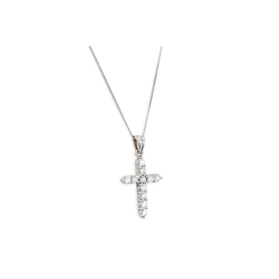 A DIAMOND SET CROSS, the brilliant cut diamonds mounted in 1...
